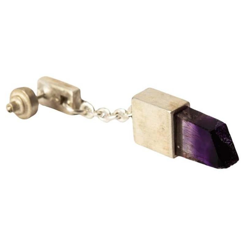 Dangle earring in sterling silver and a slab of rough diamond with amethyst crystal. This slab is removed from a larger chunk of diamond. This item is made with a naturally occurring element and will vary from the photograph you see. Each piece is