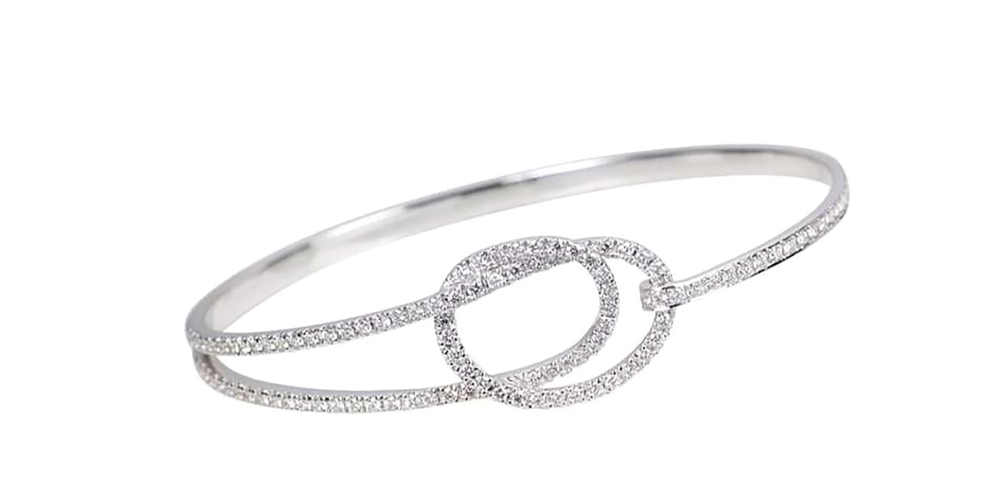Talisman: Eternity Knot Diamond 1.25 carats Bangle in 18K White Gold  Settings

Width: 1.6 cm
Diameter: 6.0 cm

Each talisman bears modern comfort and sensibility while embracing the beauty of ancient motifs, beliefs and cultures.
FOUNDED BY