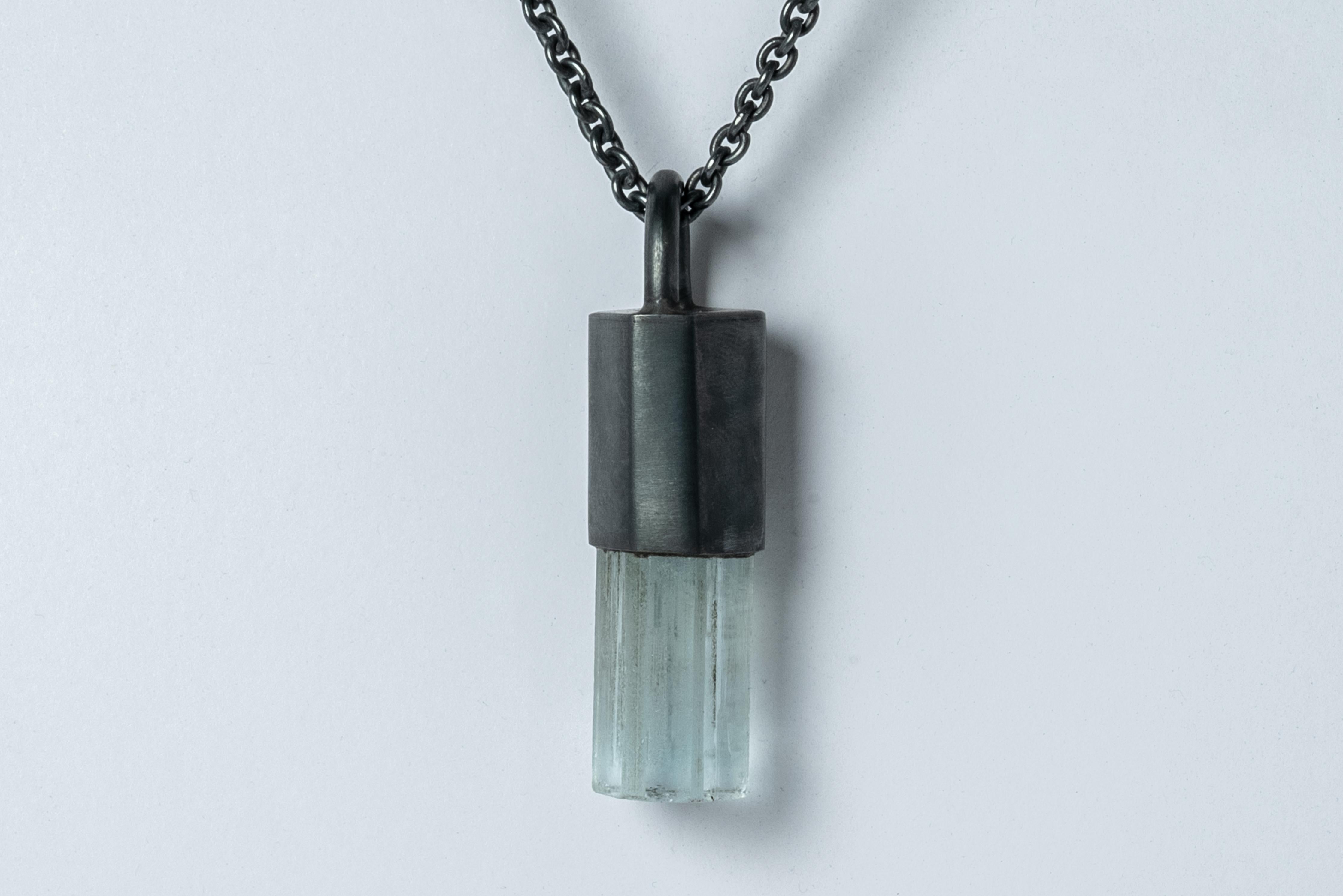 Talisman necklace in surface oxidized sterling silver and a rough of aquamarine. The Talisman series is an exploration into the power of natural crystals. Tools for Magic. The crystals used in these pieces are discovered through adventure and are