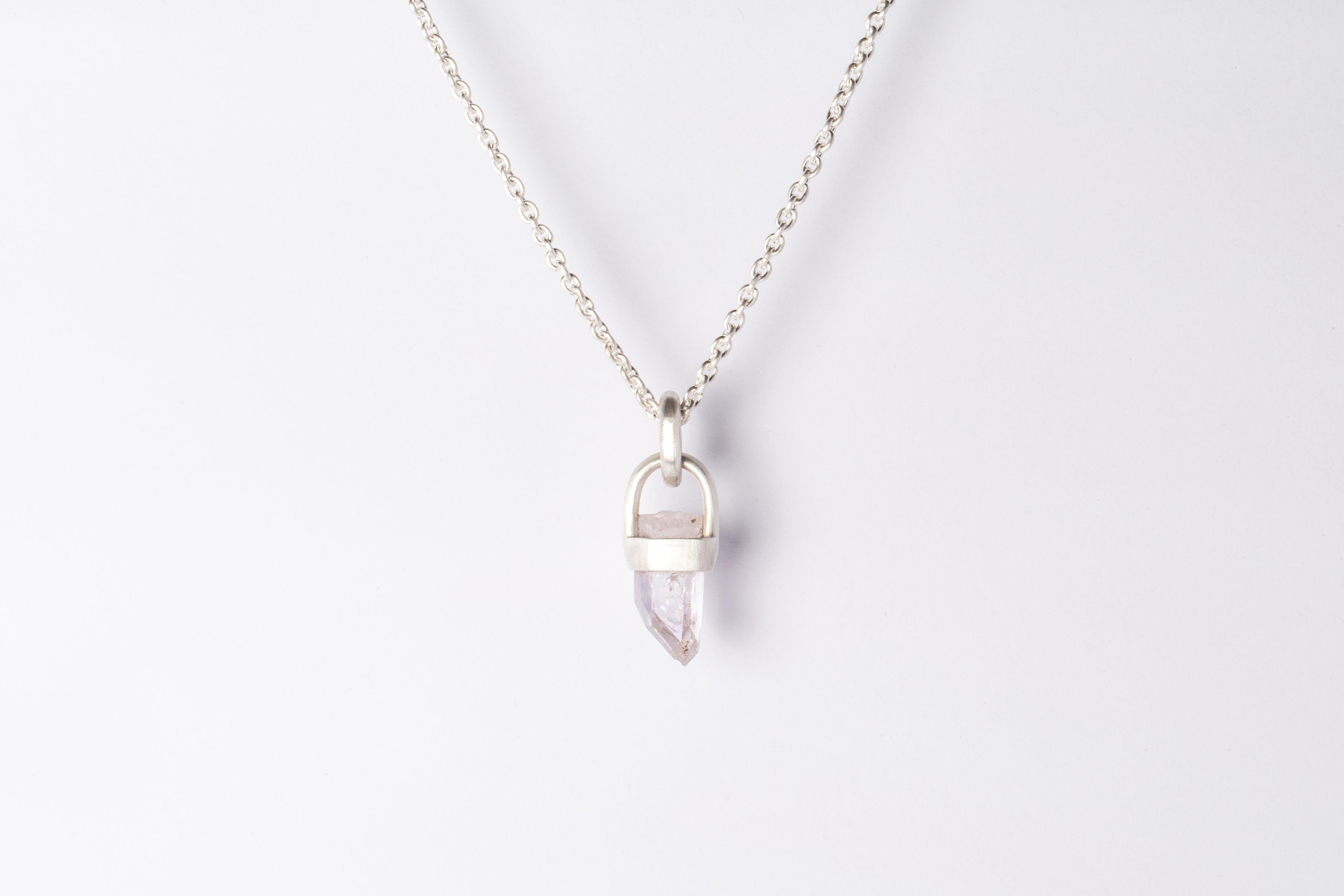 Pendant necklace in matte sterling silver and a rough of Amethyst. It comes on 74 cm sterling silver chain.

The Talisman series is an exploration into the power of natural crystals. The crystals used in these pieces are discovered through adventure