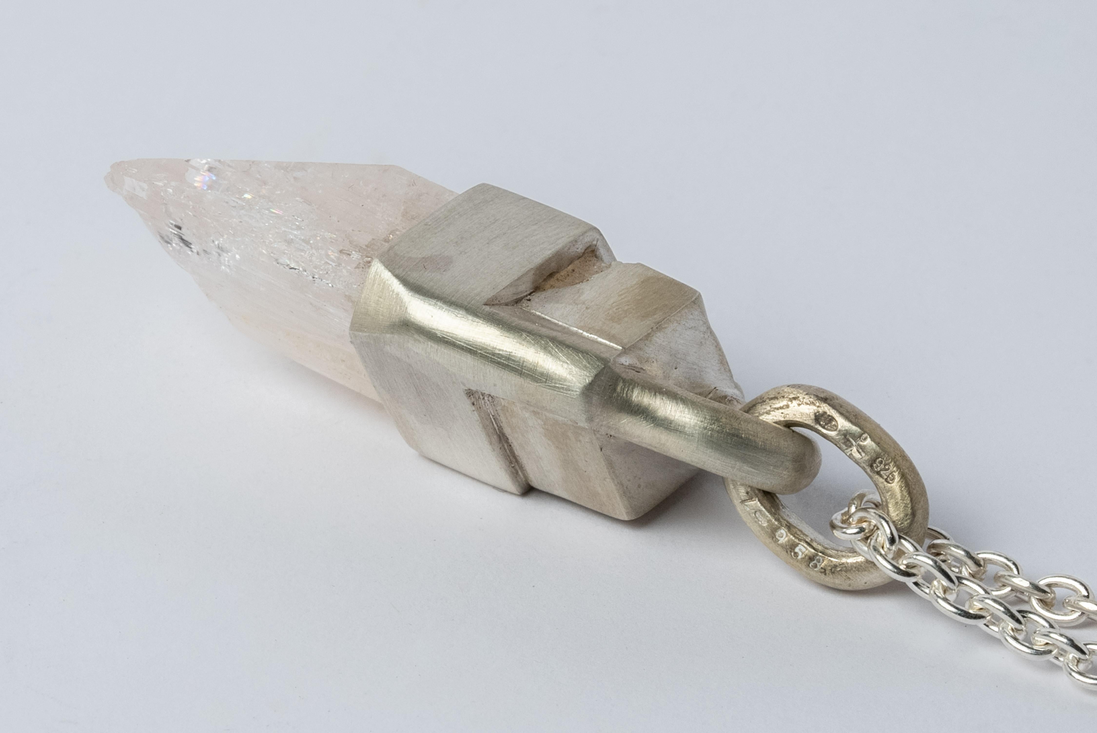 Pendant necklace in sterling silver and a rough of danburite. It comes on 74 cm sterling silver chain.
The Talisman series is an exploration into the power of natural crystals. The crystals used in these pieces are discovered through adventure and