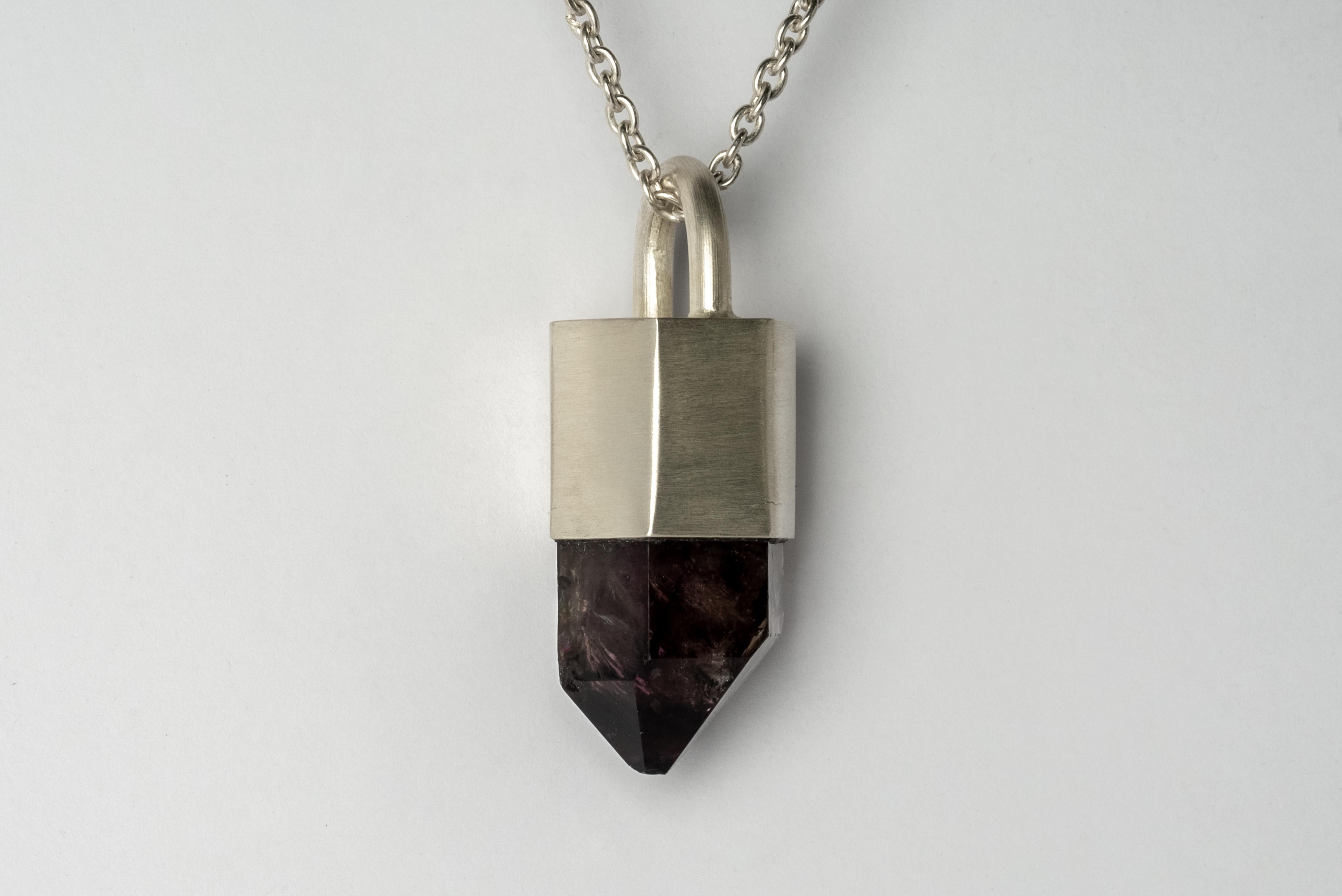 Necklace in matte sterling silver and a rough of brandberg quartz. The Talisman series is an exploration into the power of natural crystals. Tools for Magic. The crystals used in these pieces are discovered through adventure and are hand selected.