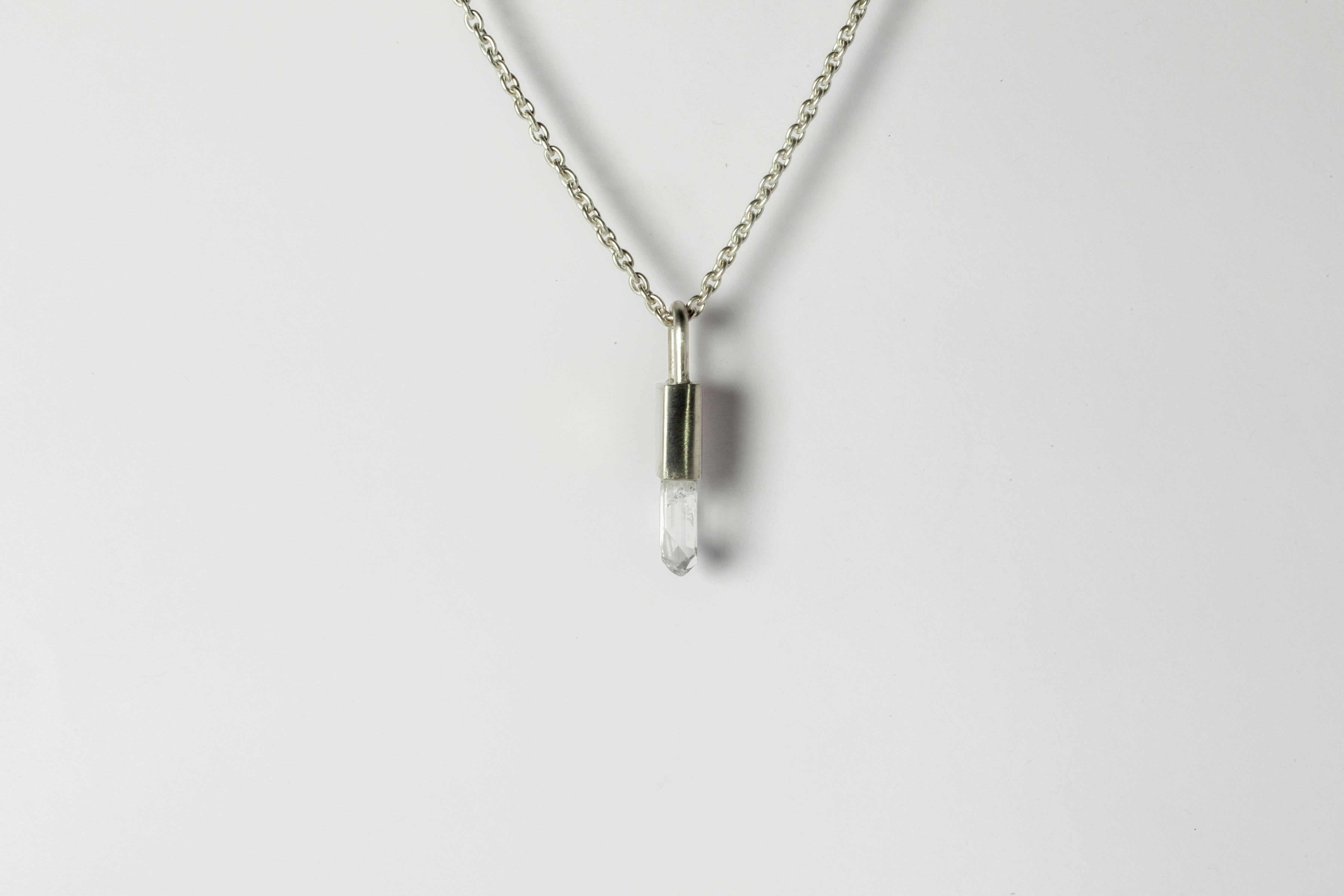 Pendant necklace in matte sterling silver and a rough of danburite. It comes on 74 cm sterling silver chain.
The Talisman series is an exploration into the power of natural crystals. The crystals used in these pieces are discovered through adventure