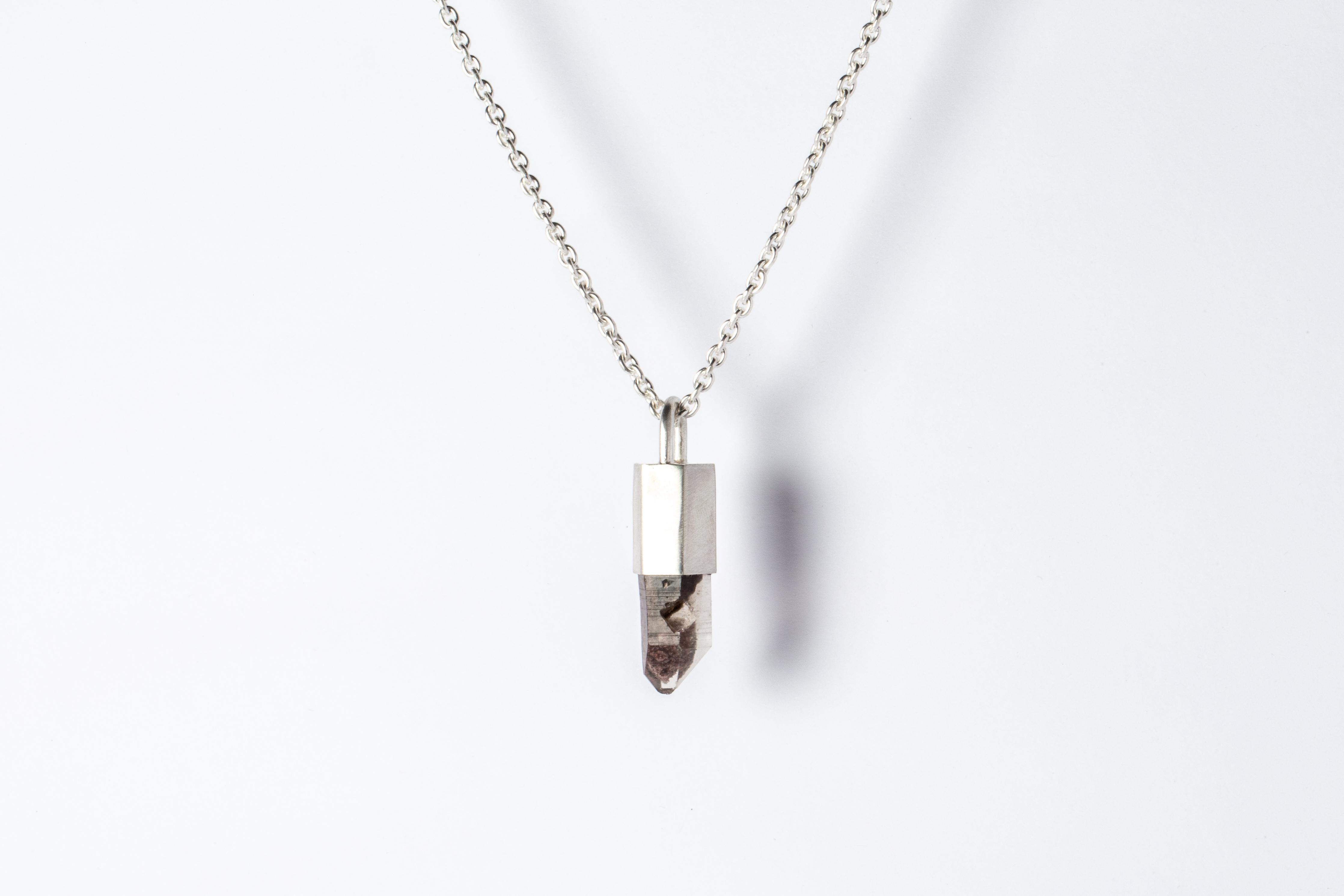 Necklace in matte sterling silver and a rough of garden quartz. It comes on 74 cm sterling silver.
The Talisman series is an exploration into the power of natural crystals. The crystals used in these pieces are discovered through adventure and are