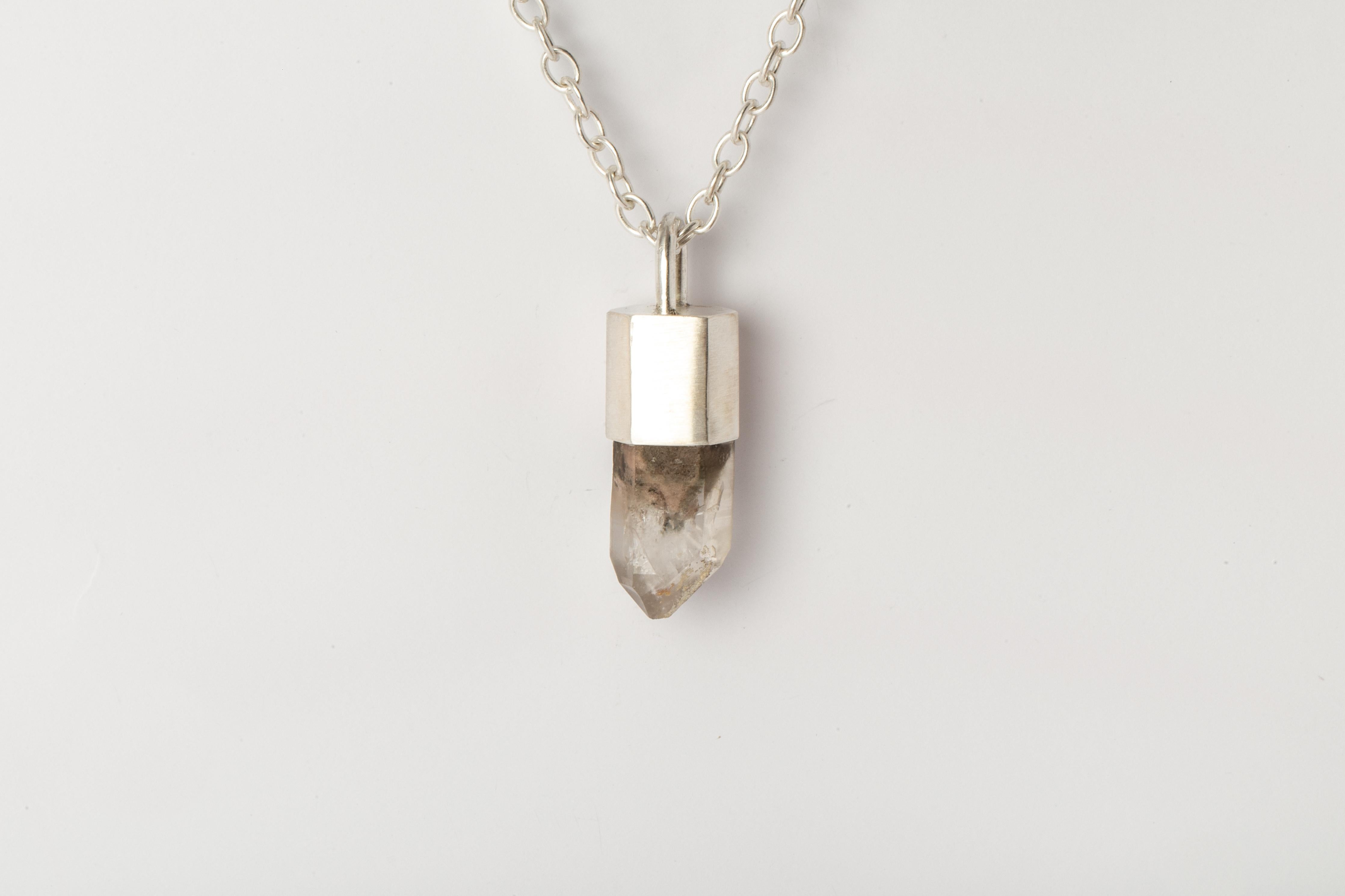 Pendant necklace in matte sterling silver and a garden quartz. It comes on 74 cm sterling silver chain.
The Talisman series is an exploration into the power of natural crystals. The crystals used in these pieces are discovered through adventure and