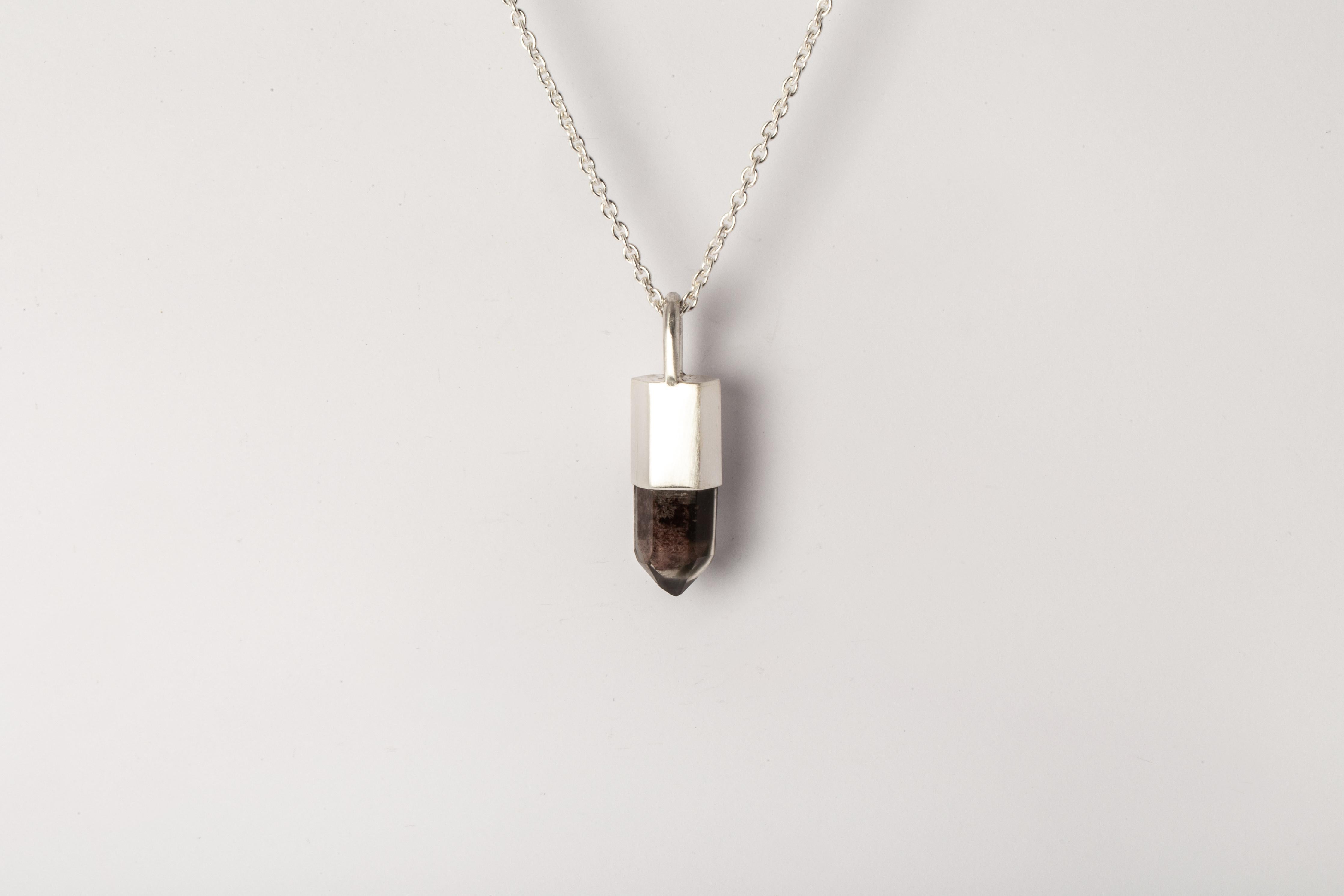 Pendant necklace made in matte sterling silver and a hexagon cut of Garden Quartz. It comes on 74 cm sterling silver chain.
The Talisman series is an exploration into the power of natural crystals. The crystals used in these pieces are discovered