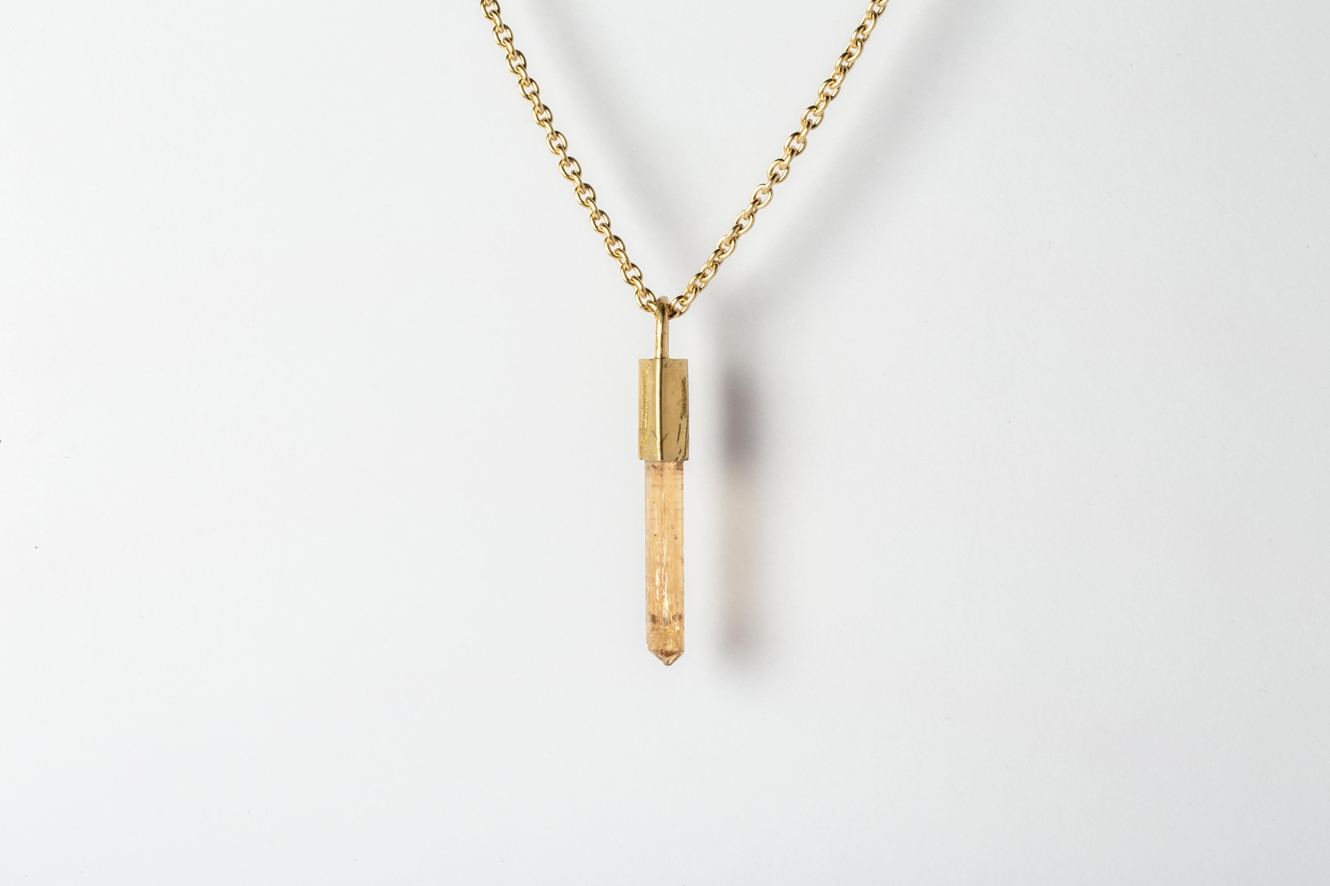 Necklace made in electroplated brass with 18k gold, electroplated sterling silver with 18k gold, and a slab of rough imperial topaz. The Talisman series is an exploration into the power of natural crystals. Tools for Magic. The crystals used in
