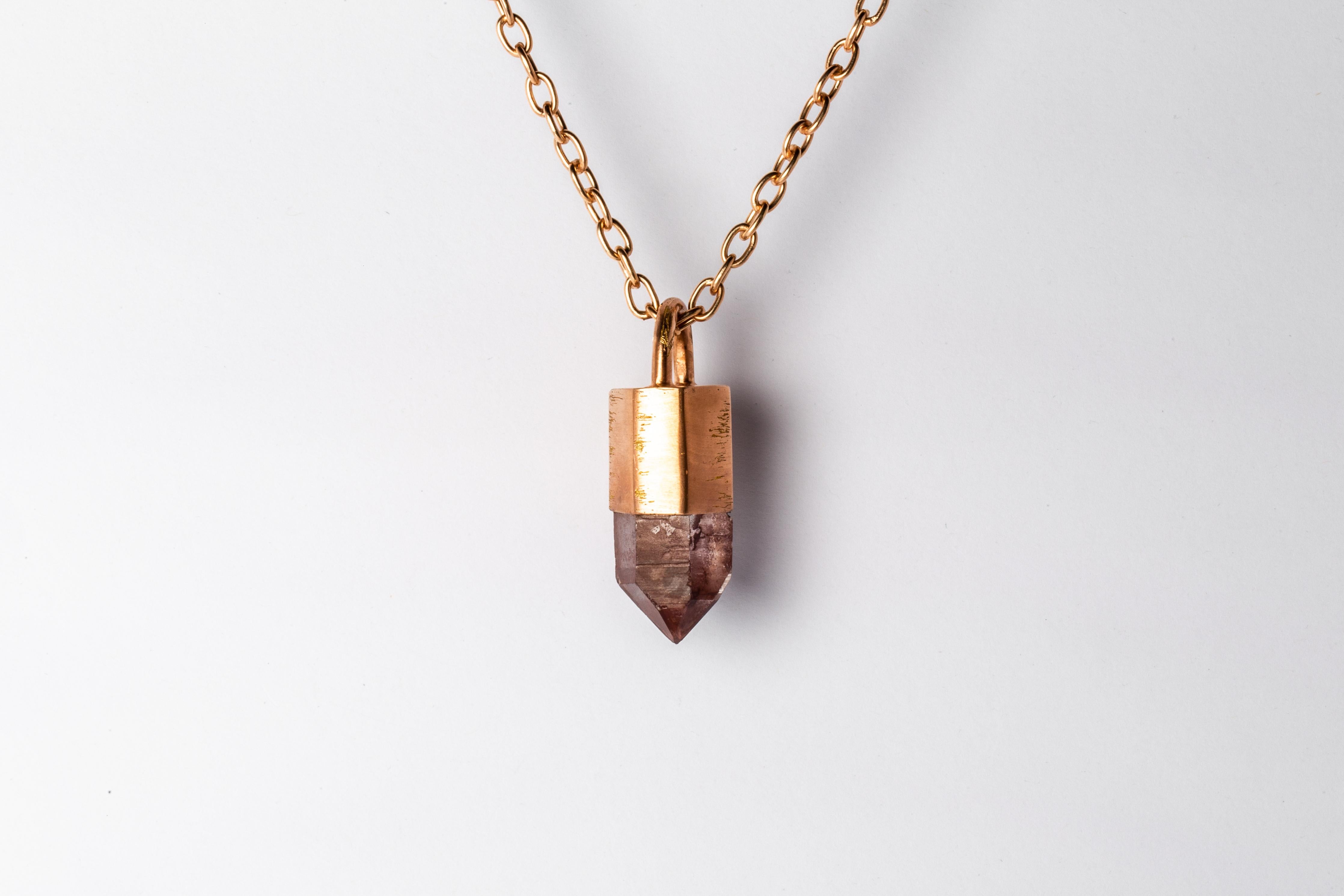 Necklace in brass, sterling silver, and a rough of iron quartz. Brass and sterling silver substrates are electroplated with 18k Rose Gold and then dipped into acid to create the subtly destroyed surface. The Talisman series is an exploration into