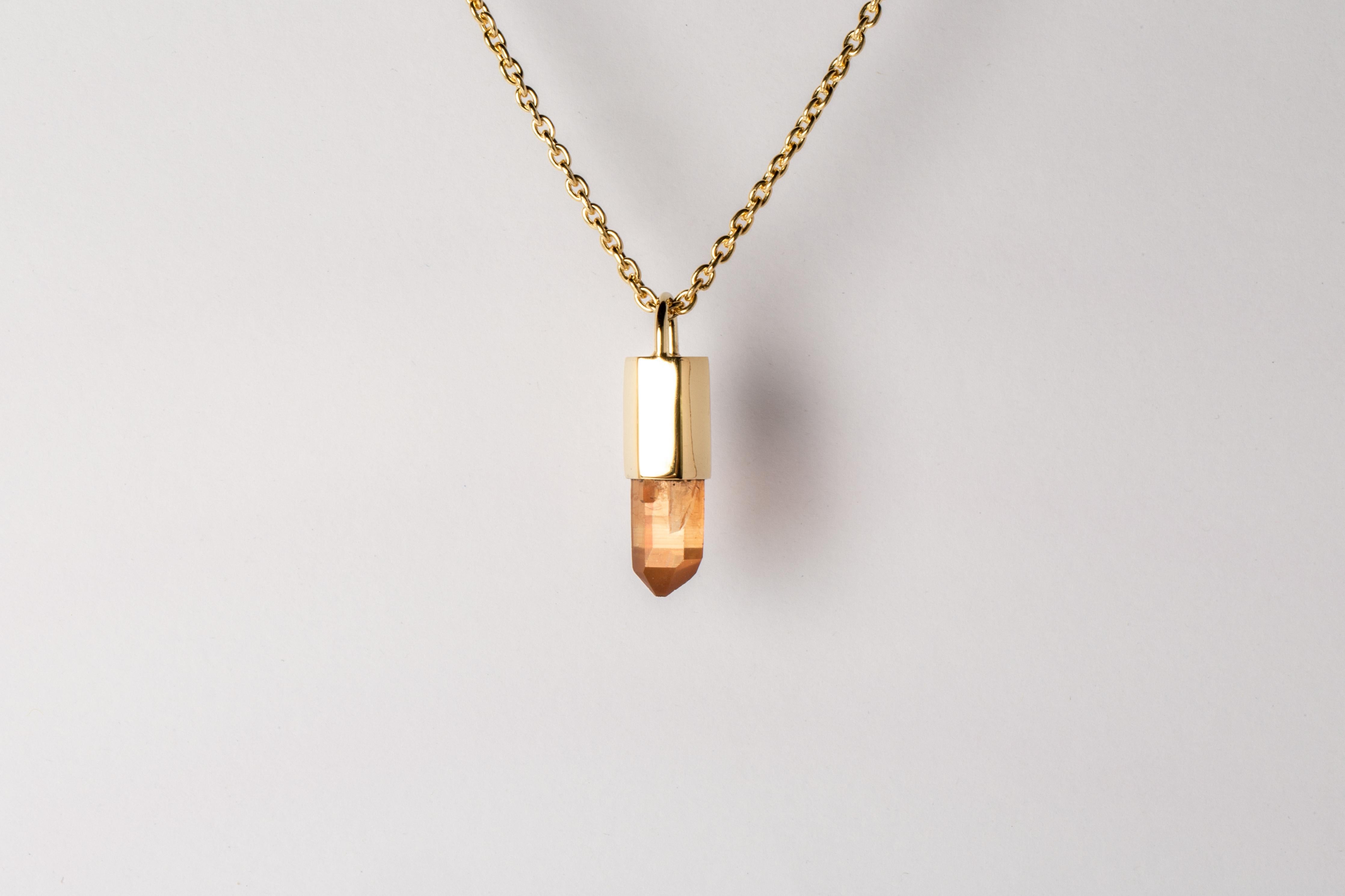 Pendant necklace in brass and sterling silver, it comes on a 74cm chain in sterling silver. Brass and sterling silver are substrate, polished and electroplated with 18k solid yellow gold and a slab of rough iron quartz. The Talisman series is an