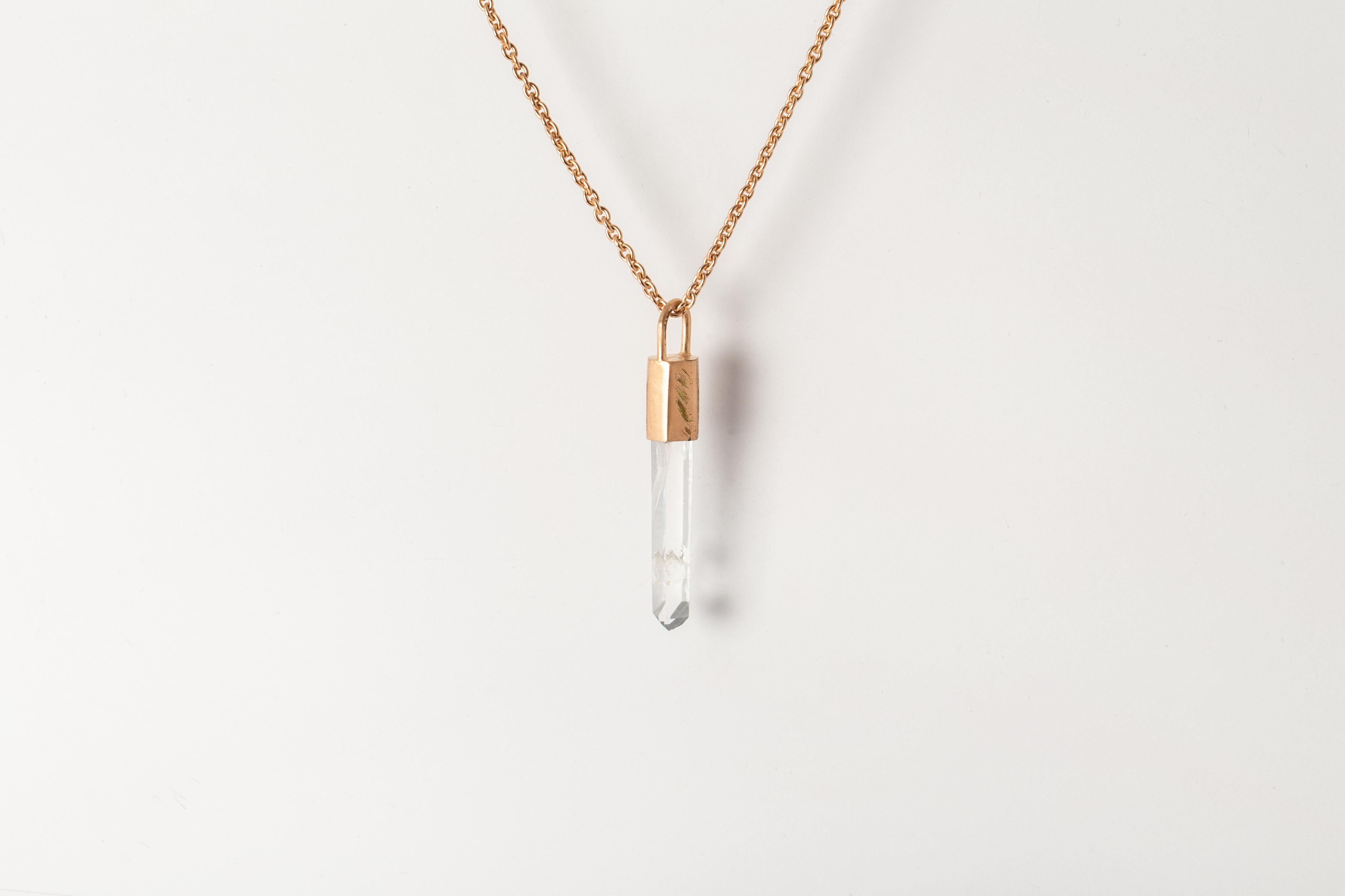 Pendant necklace in brass, sterling silver, and a rough of lemurian quartz. Brass and sterling silver substrates are electroplated with 18k rose gold and then dipped into acid to create the subtly destroyed surface.
The Talisman series is an