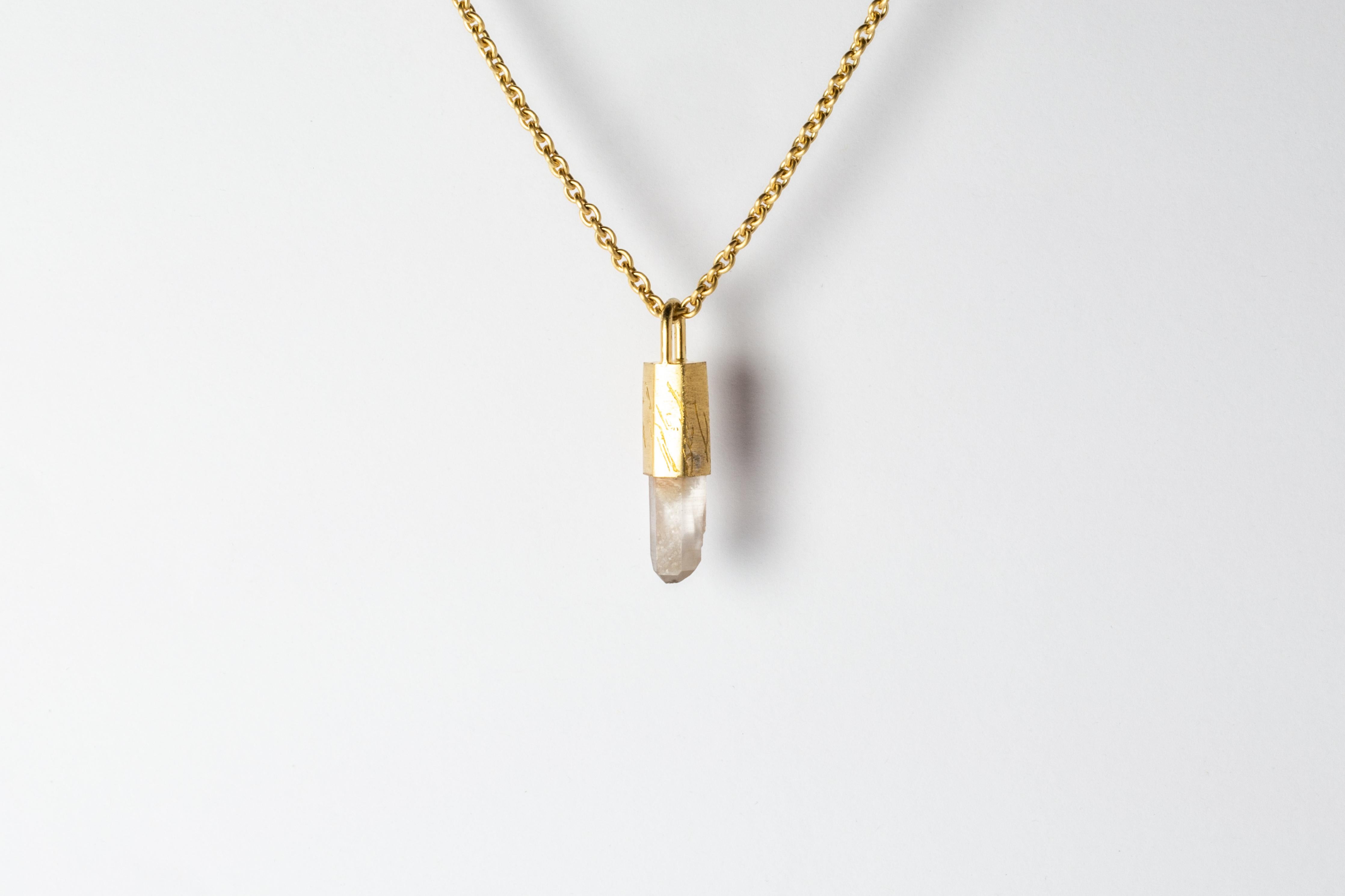Pendant necklace in brass, sterling silver, and a rough of misc quartz. Brass and sterling silver are electroplated with 18k gold and then dipped into acid to create the subtly destroyed surface.
The Talisman series is an exploration into the power