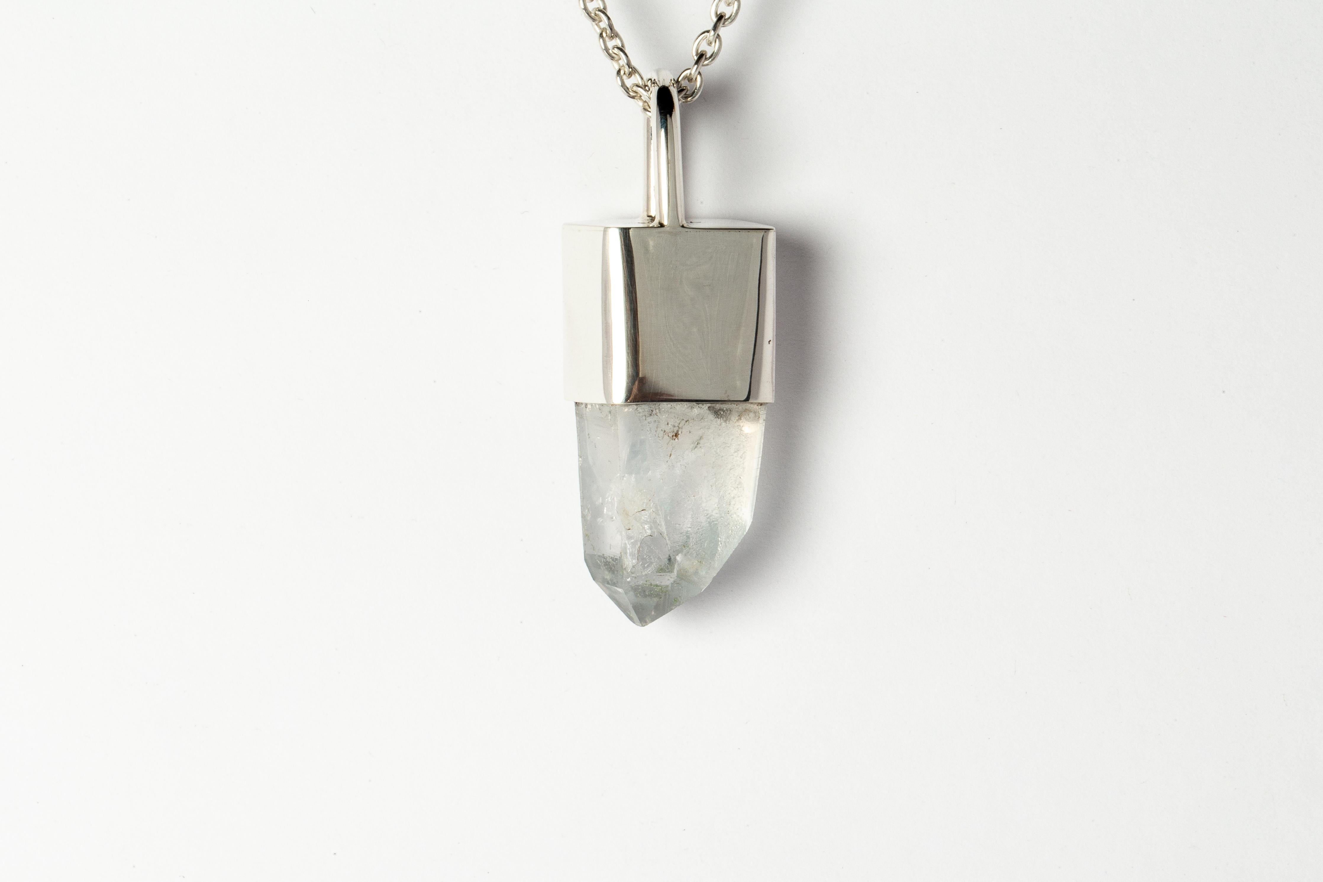 Pendant necklace in polished sterling silver and a slab of rough misc quartz. It comes on a 75 cm sterling silver.
The Talisman series is an exploration into the power of natural crystals. Tools for Magic. The crystals used in these pieces are
