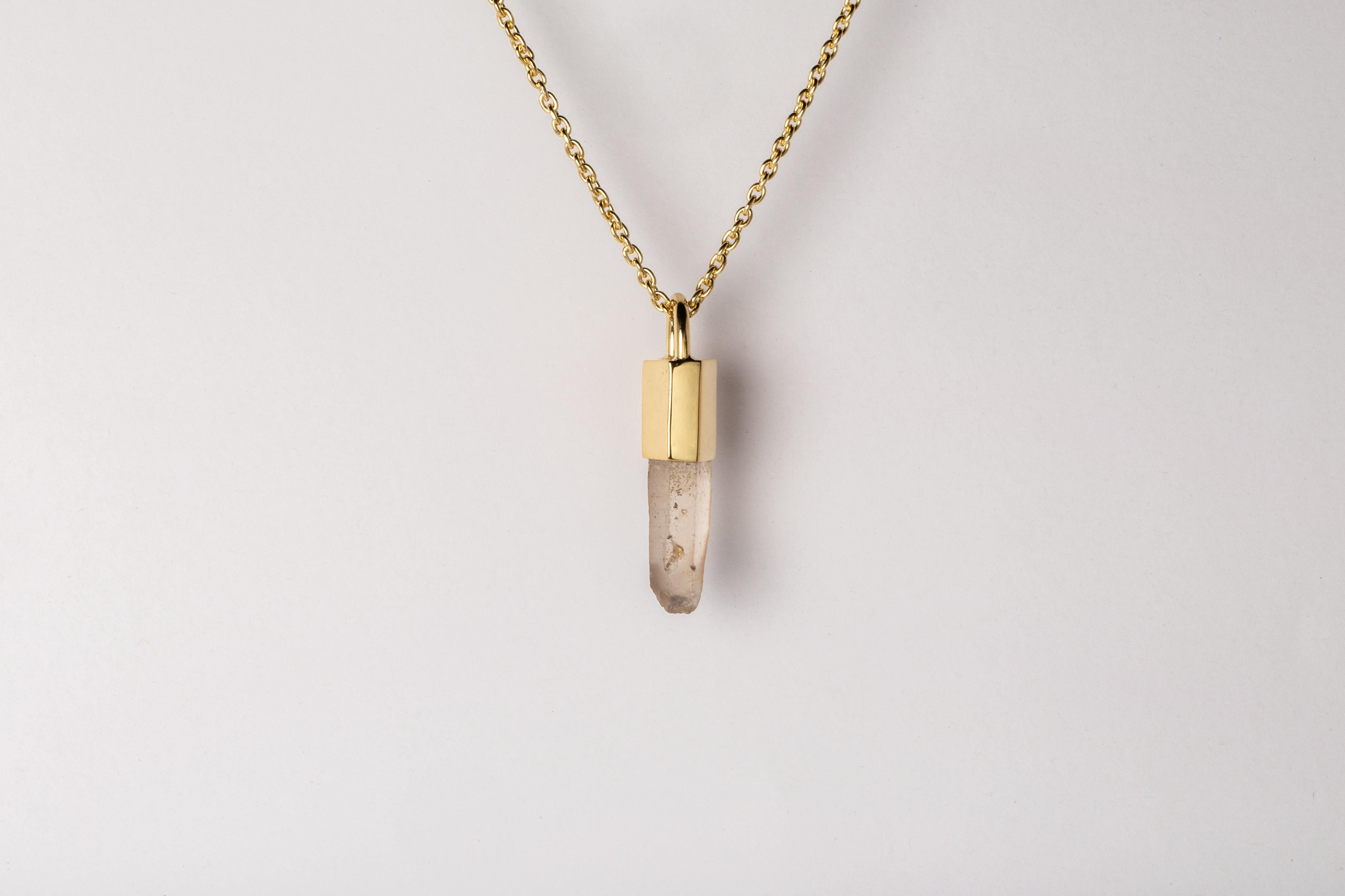 Pendant necklace in brass, sterling silver, and a rough of misc quartz. Brass and sterling silver are substrates, polished, and electroplated with 18k gold.
The Talisman series is an exploration into the power of natural crystals. The crystals used