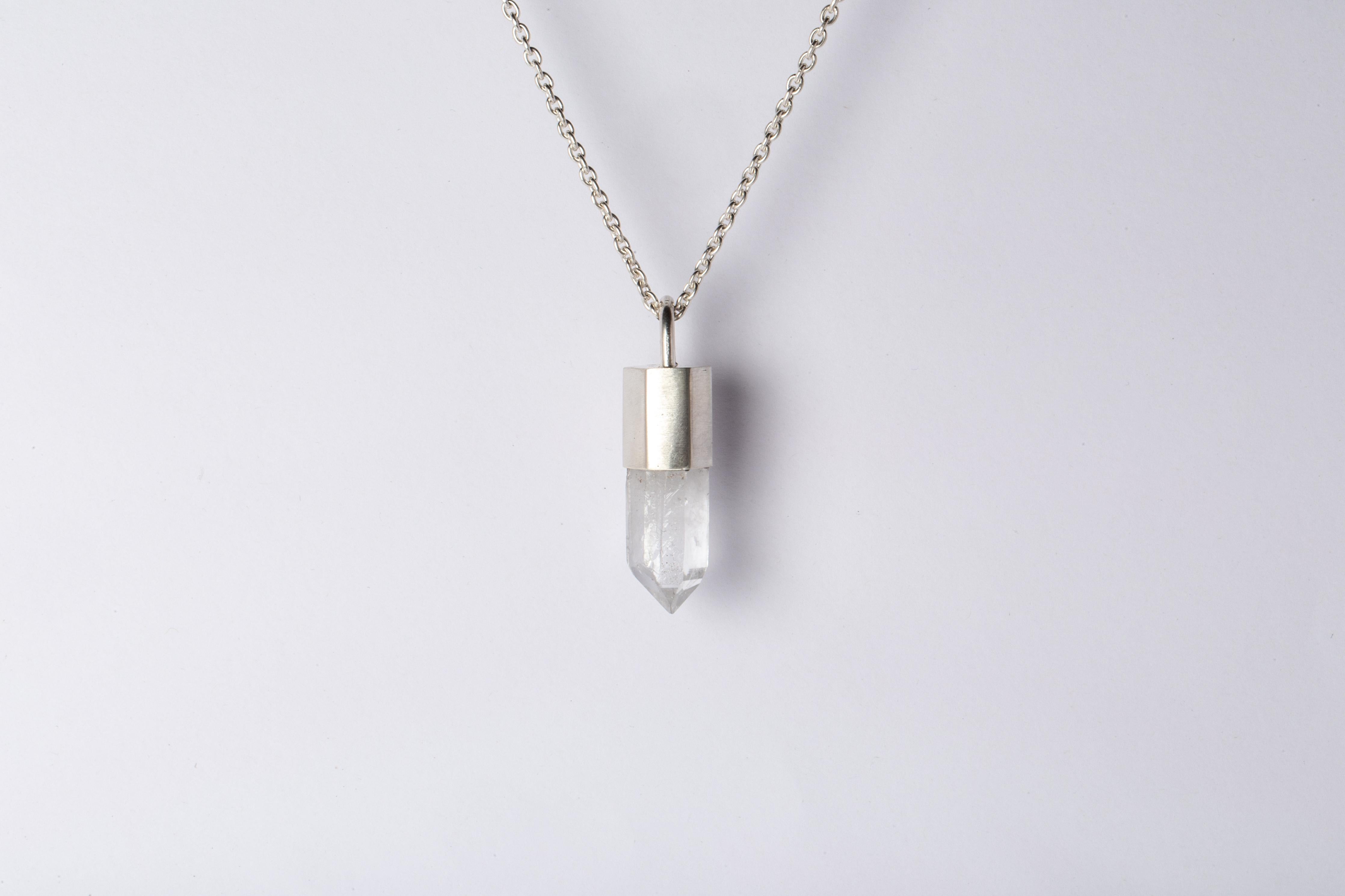 Pendant necklace in matte sterling silver and a rough of misc quartz. It comes on 74 cm sterling silver chain.
The Talisman series is an exploration into the power of natural crystals. The crystals used in these pieces are discovered through
