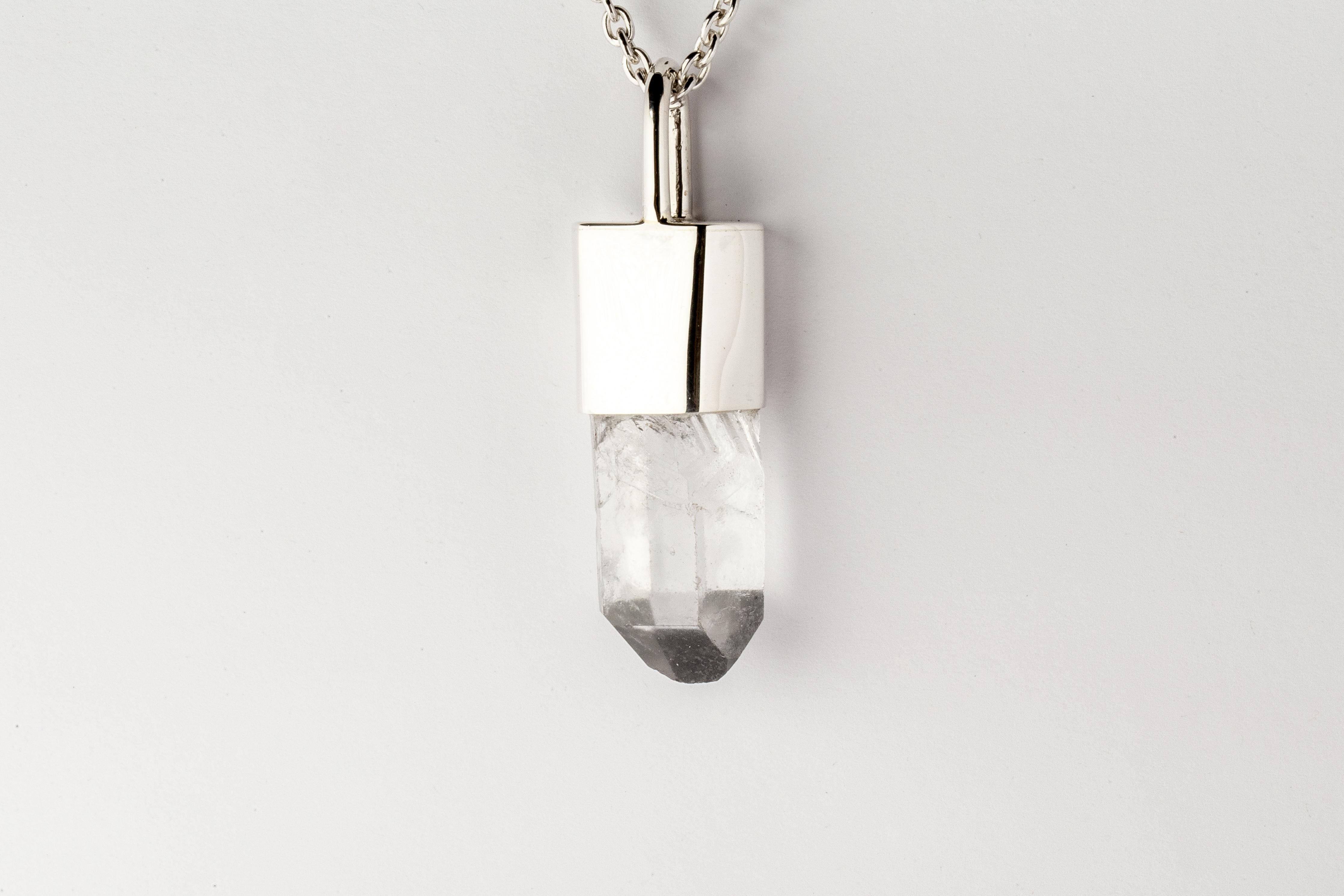 Necklace in polished sterling silver and a rough of misc quartz. It comes on 74 cm sterling silver.
The Talisman series is an exploration into the power of natural crystals. The crystals used in these pieces are discovered through adventure and are