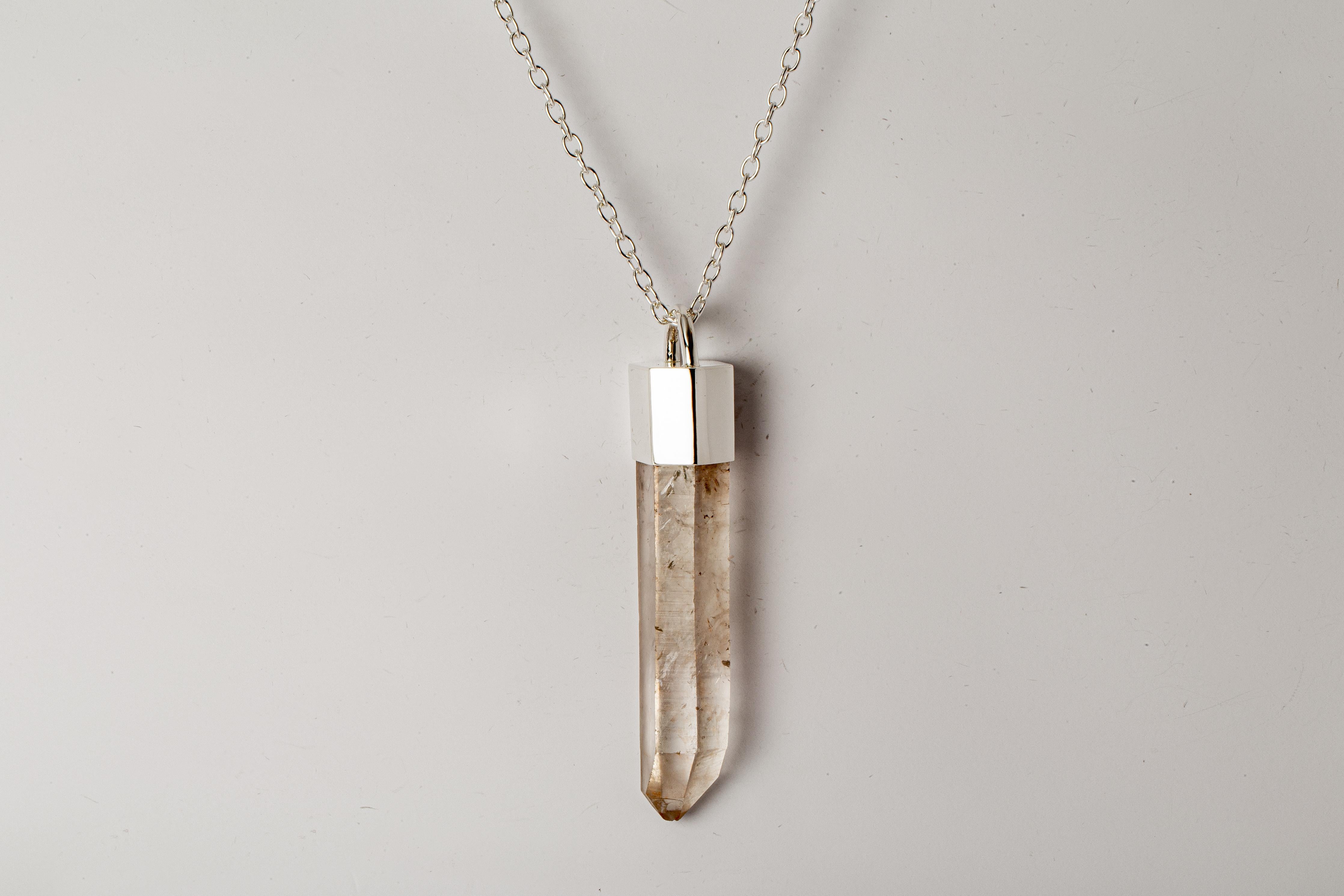 Necklace in polished sterling silver and rough of lemurian quartz. The Talisman series is an exploration into the power of natural crystals. Tools for Magic. The crystals used in these pieces are discovered through adventure and are hand selected.