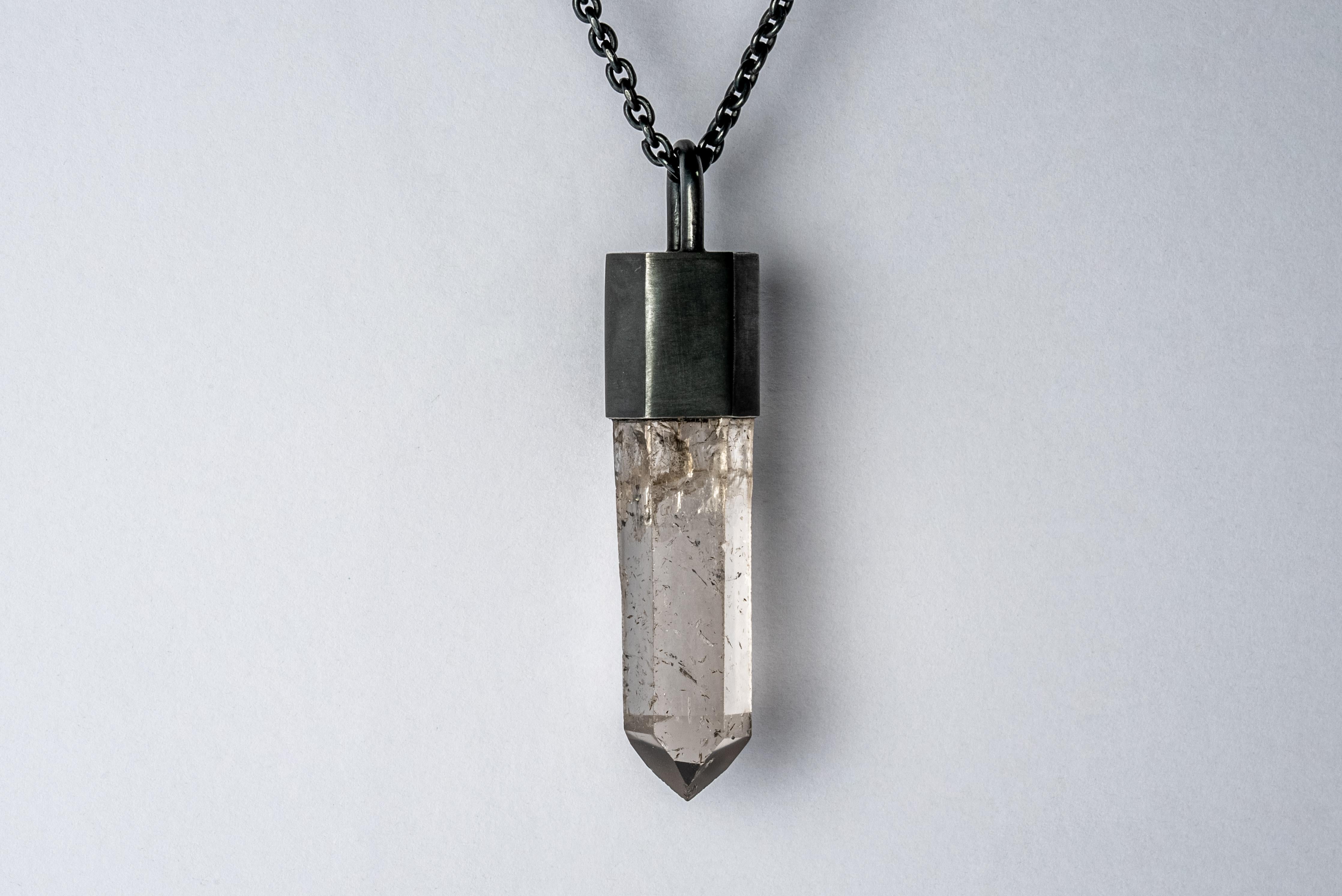 Pendant necklace in black sterling silver and a rough of smoky quartz. Black Sterling is a surface oxidation of sterling silver. This finish may fade over time, which can be considered an enhancement. Please note that Black Sterling tends to appear