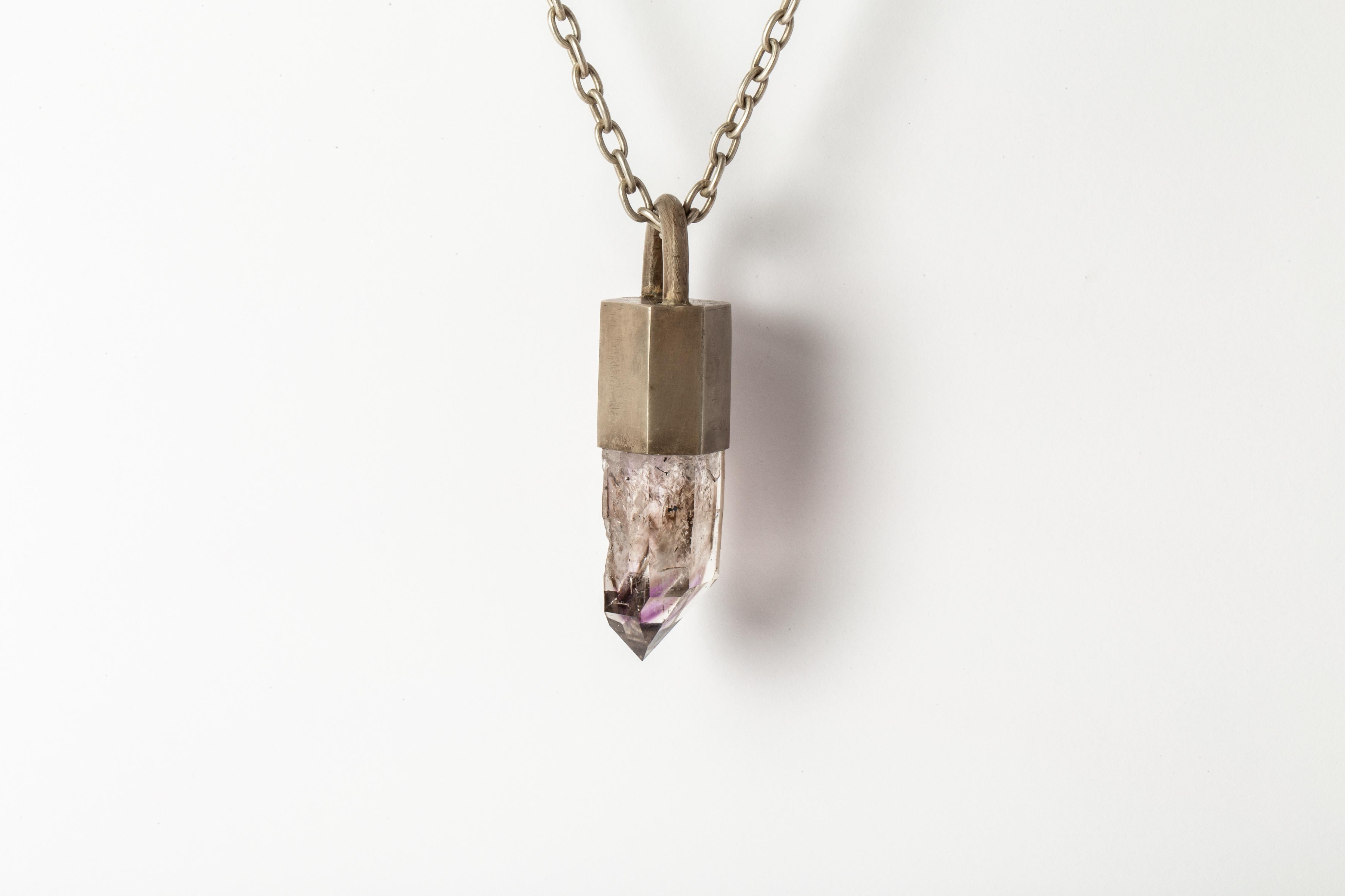 Talisman necklace in acid treated sterling silver and slab of brandberg quartz. The Talisman series is an exploration into the power of natural crystals. The crystals used in these pieces are discovered through adventure and are hand selected. Each