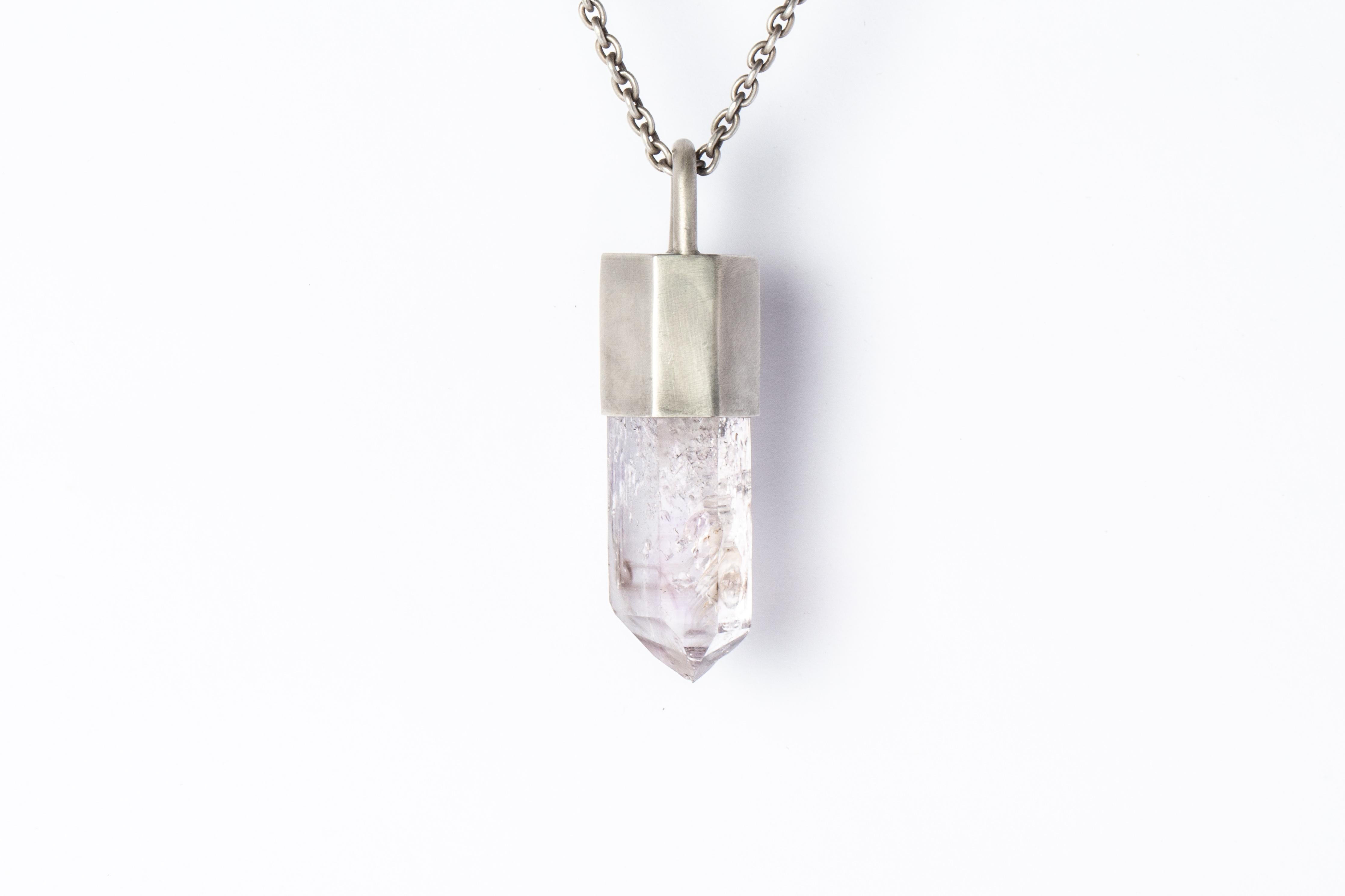 Necklace in acid treated sterling silver and a rough of brandberg quartz. The Talisman series is an exploration into the power of natural crystals. Each product with the status of Specimen has a unique number and is absolutely one-of-a-kind.