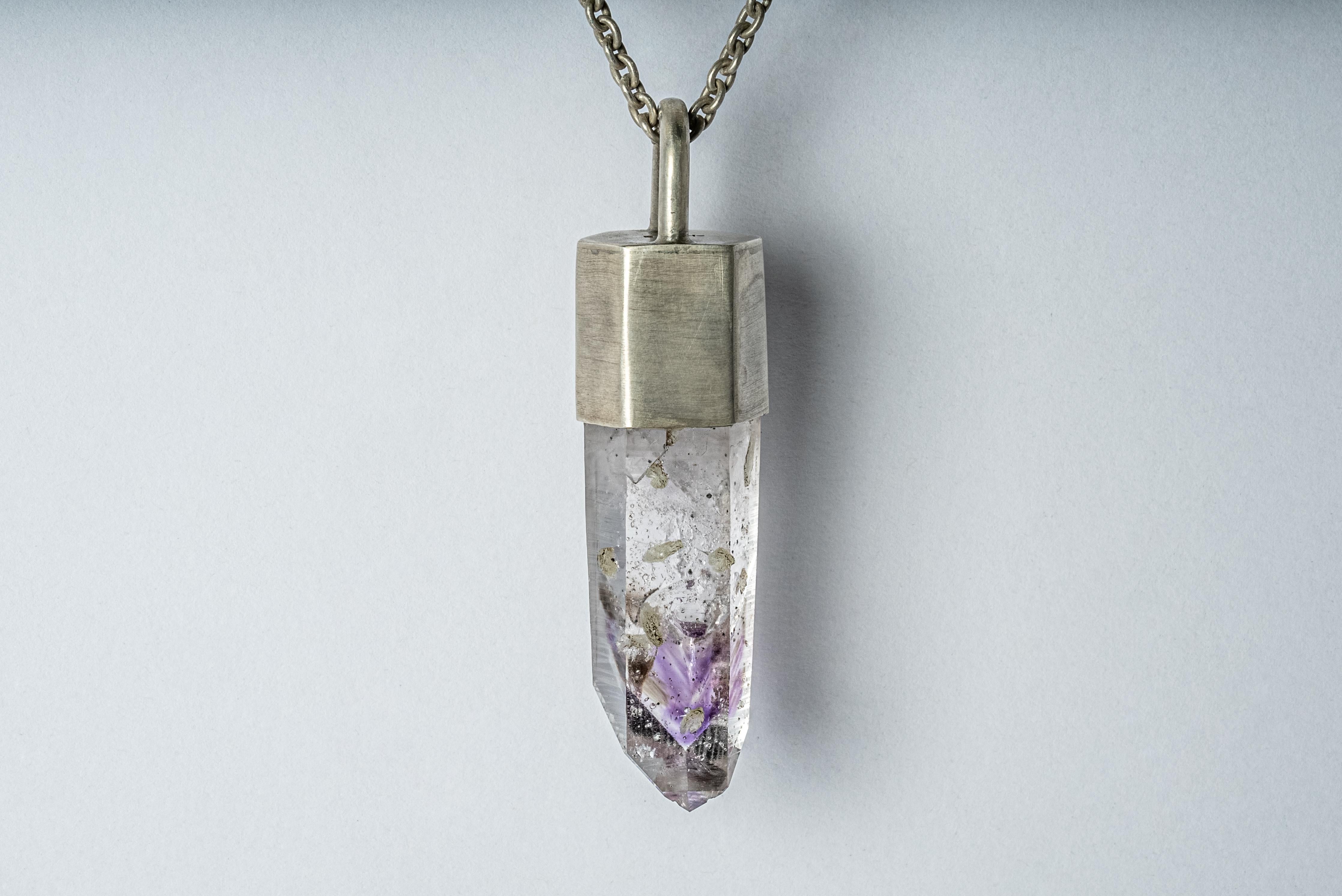 Necklace made in acid treated sterling silver and a rough of brandberg quartz. The Talisman series is an exploration into the power of natural crystals. The crystals used in these pieces are discovered through adventure and are hand selected. Each