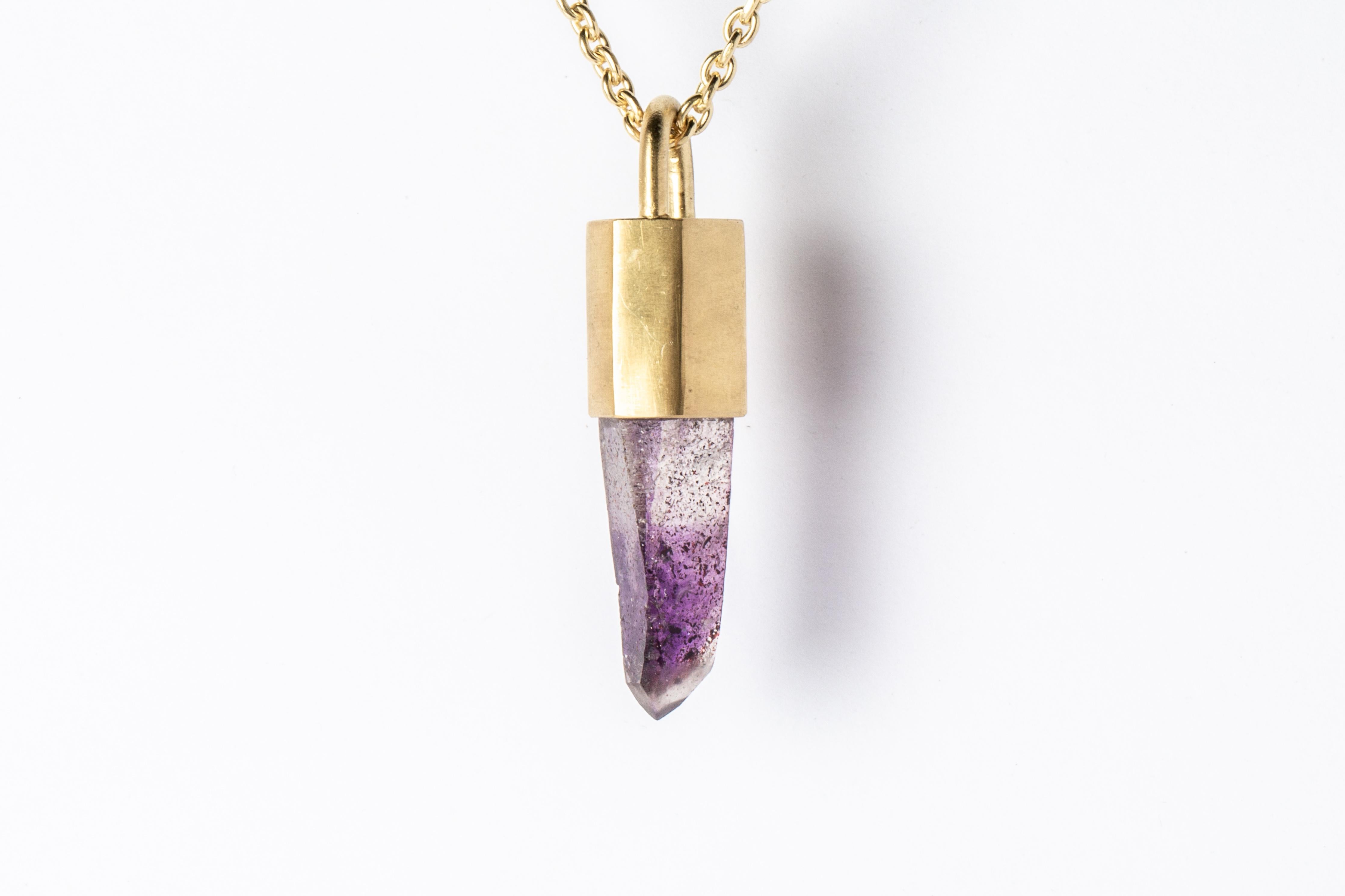 Necklace made in electroplated brass with 18k gold, electroplated sterling silver with 18k gold, and a rough of brandberg quartz. The Talisman series is an exploration into the power of natural crystals. Each product with the status of Specimen has