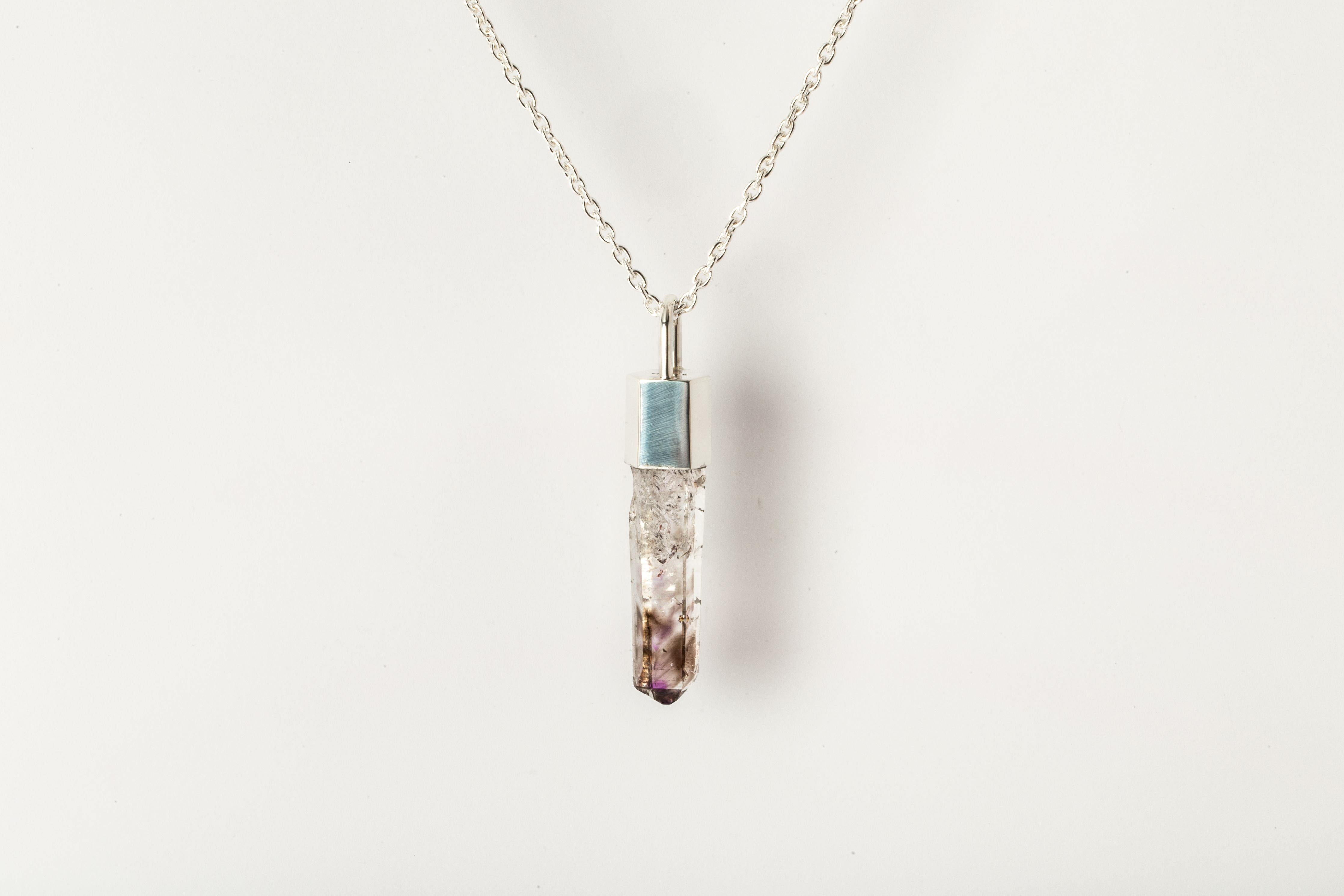 Necklace in polished sterling silver and a rough of brandnerg quartz. The Talisman series is an exploration into the power of natural crystals. Each product with the status of Specimen has a unique number and is absolutely one-of-a-kind.