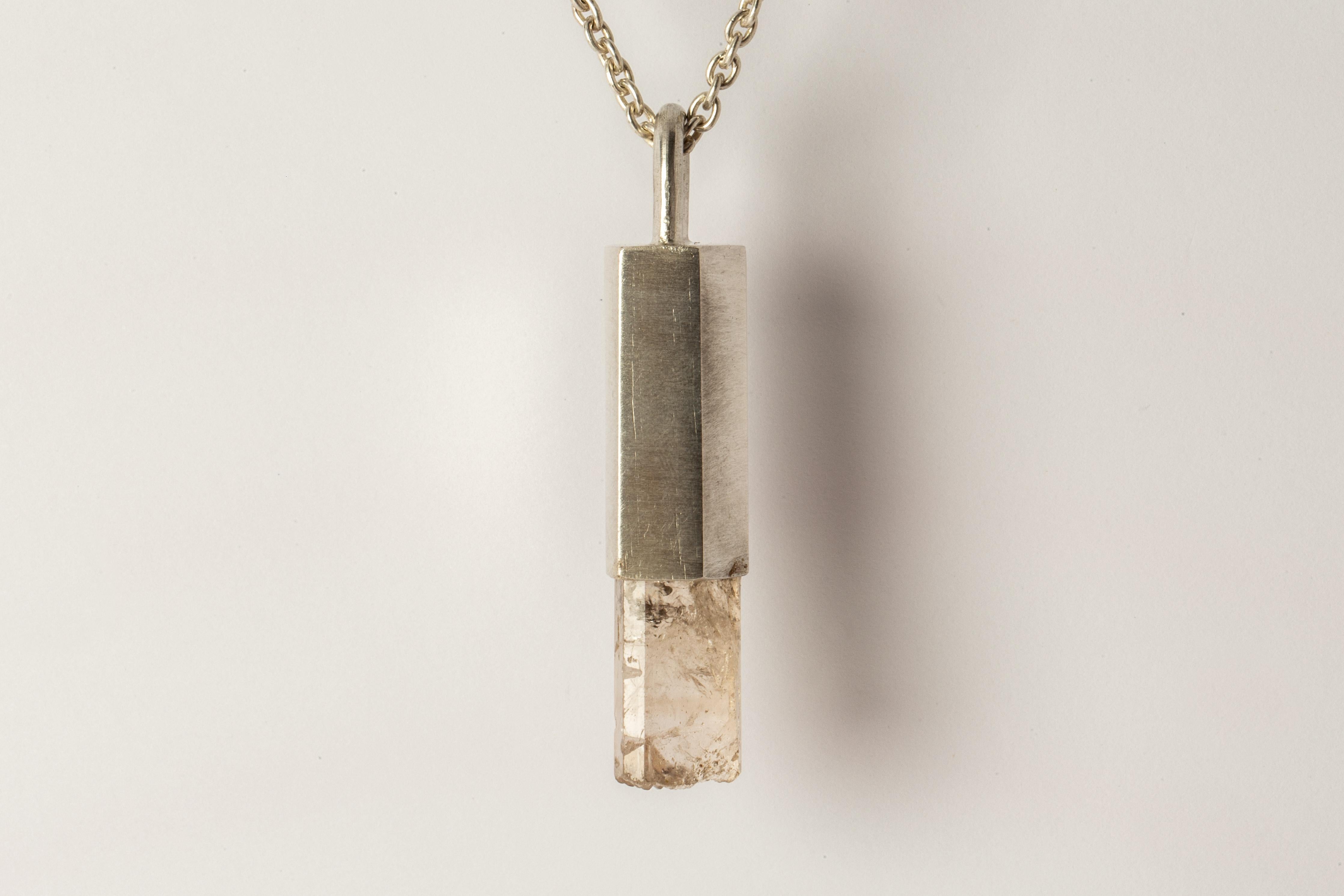 Necklace in matte sterling silver and a rough of danburite. The Talisman series is an exploration into the power of natural crystals. The title Specimen signifies a particular class of mineral that is both rare and collectable. Each product with the
