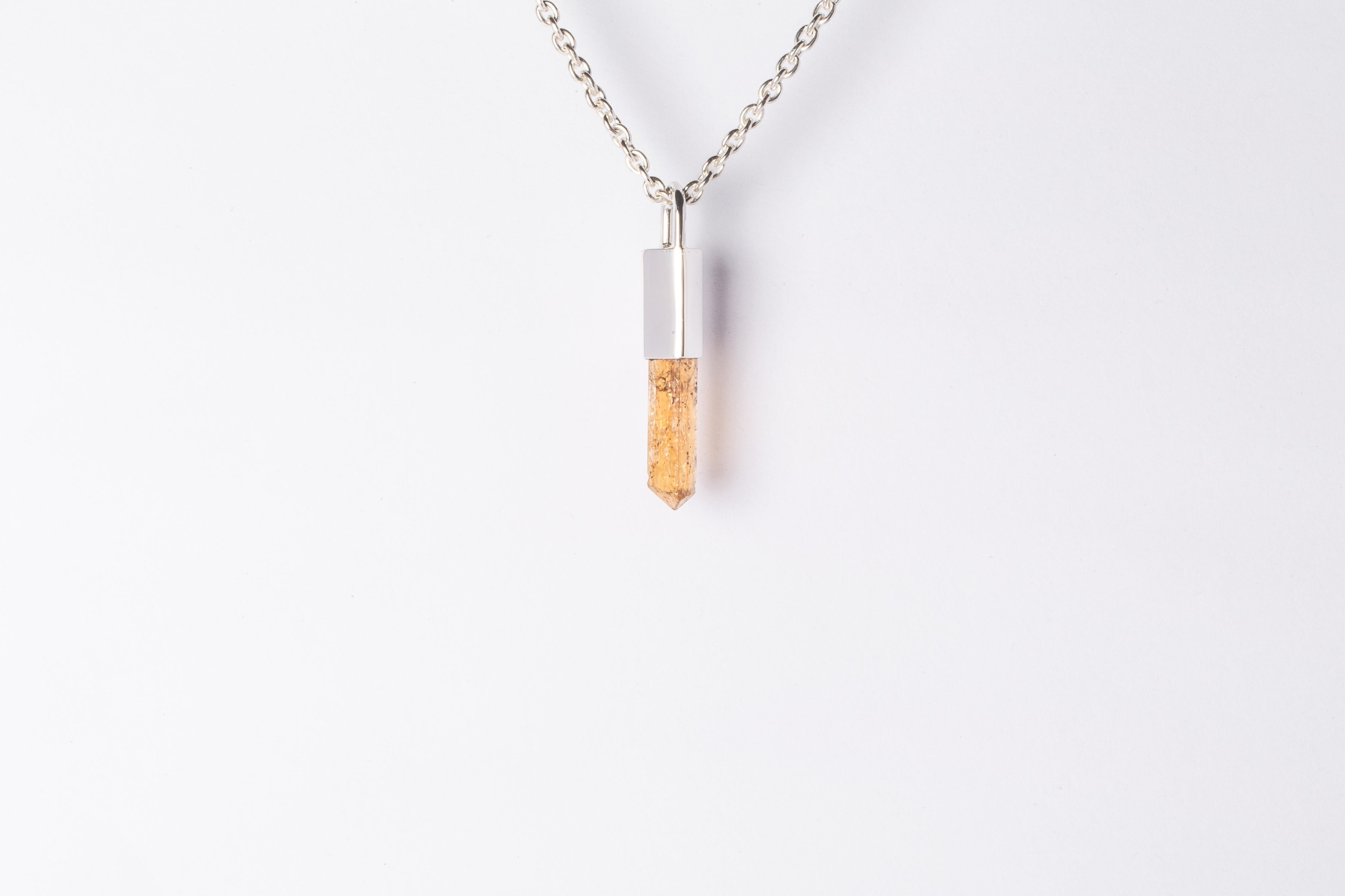 Necklace in polished sterling silver and a rough of imperial topaz. It comes on 74 cm sterling silver chain. 
The Talisman series is an exploration into the power of natural crystals. Tools for Magic. The crystals used in these pieces are discovered