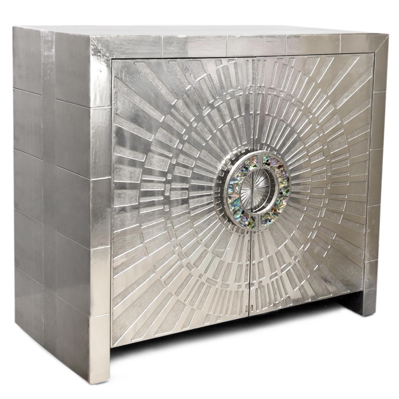 Global glamour. Crafted from nickel-plated metal with hand-stamped patterns applied to Minimalist, modernist forms, Our Talitha console is jewelry for your home. The surface is reminiscent of silver leaf it emits that same lustrous glow—but is