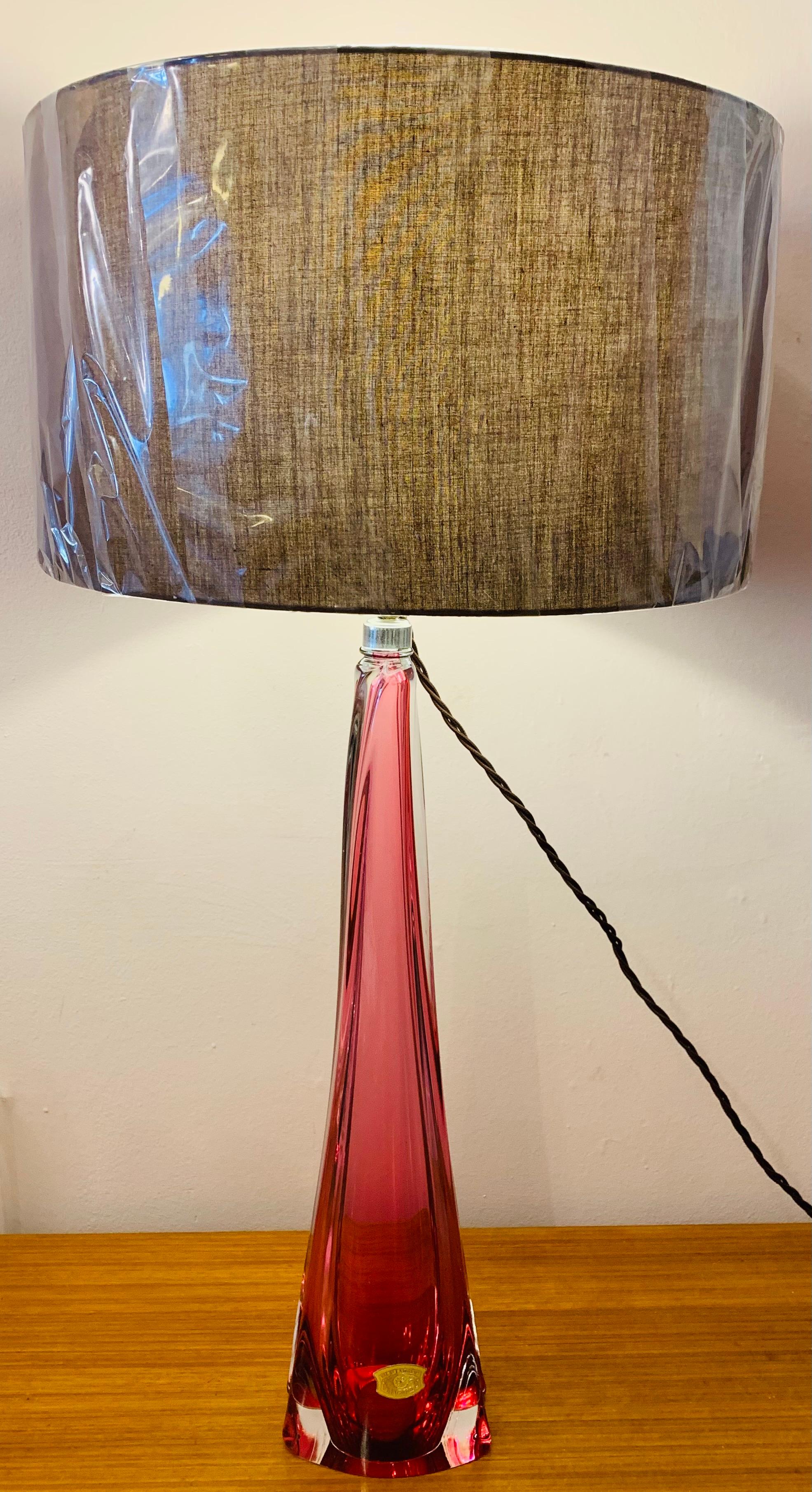 A rare to source Tall Val St Lambert, pink and clear, crystal glass lamp base with a turned tapering form at the top of the lamp. The lamp was made in the 1950s in Belgium. The lamp is fitted with a brass mounted socket fitting and bears the