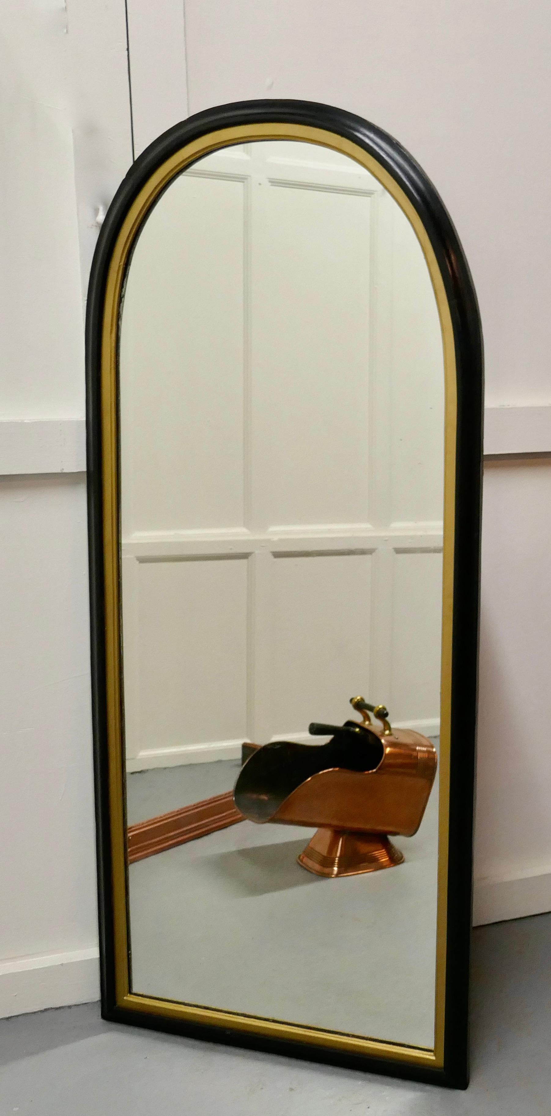 black and gold arched mirror