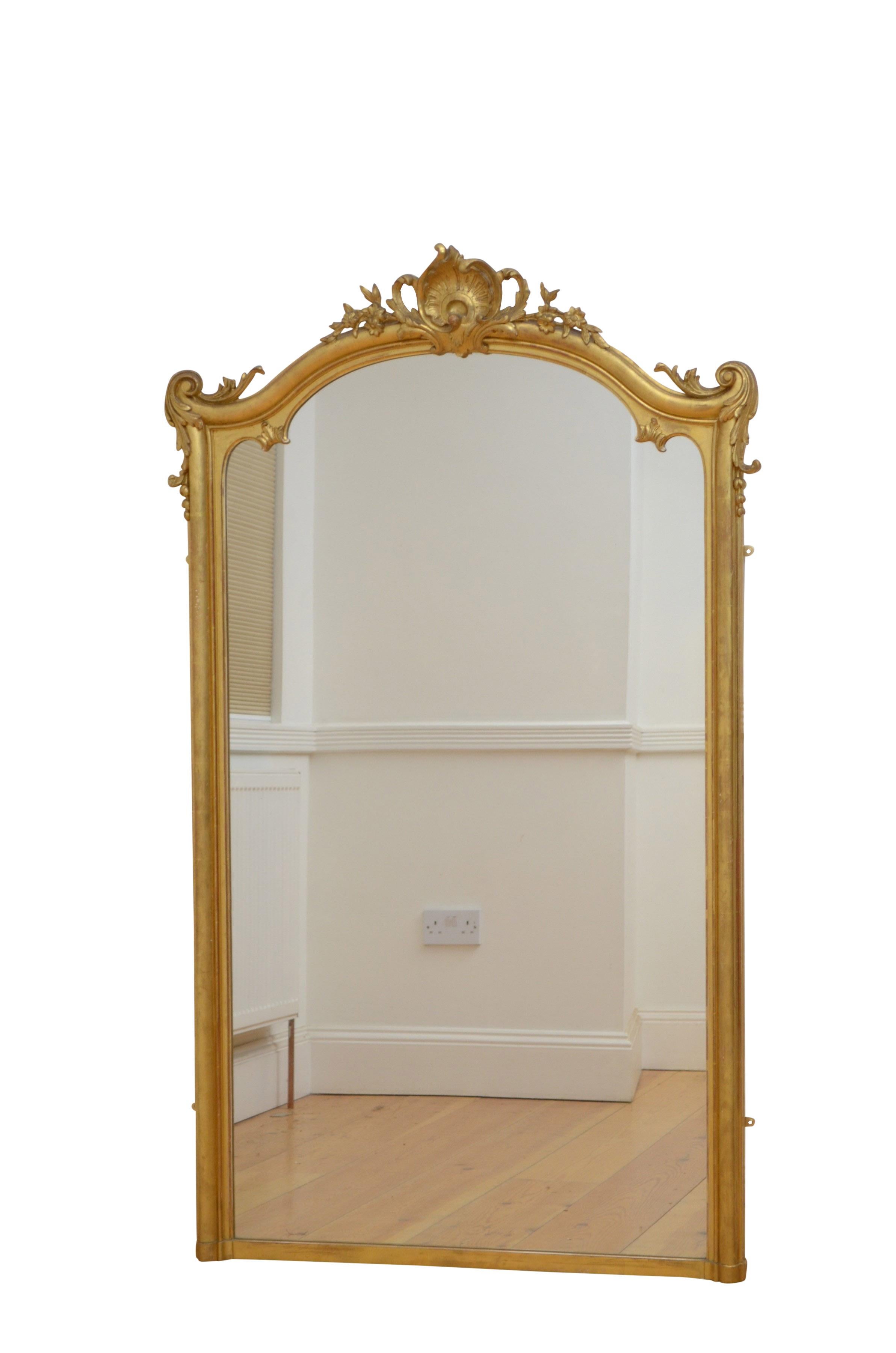 K0185  Very attractive XIXth century French giltwood wall mirror, having original plate with minor imperfections in gilded and moulded frame with acanthus scrolls to top corners and shell crest flanked by floral motifs to the centre. This antique