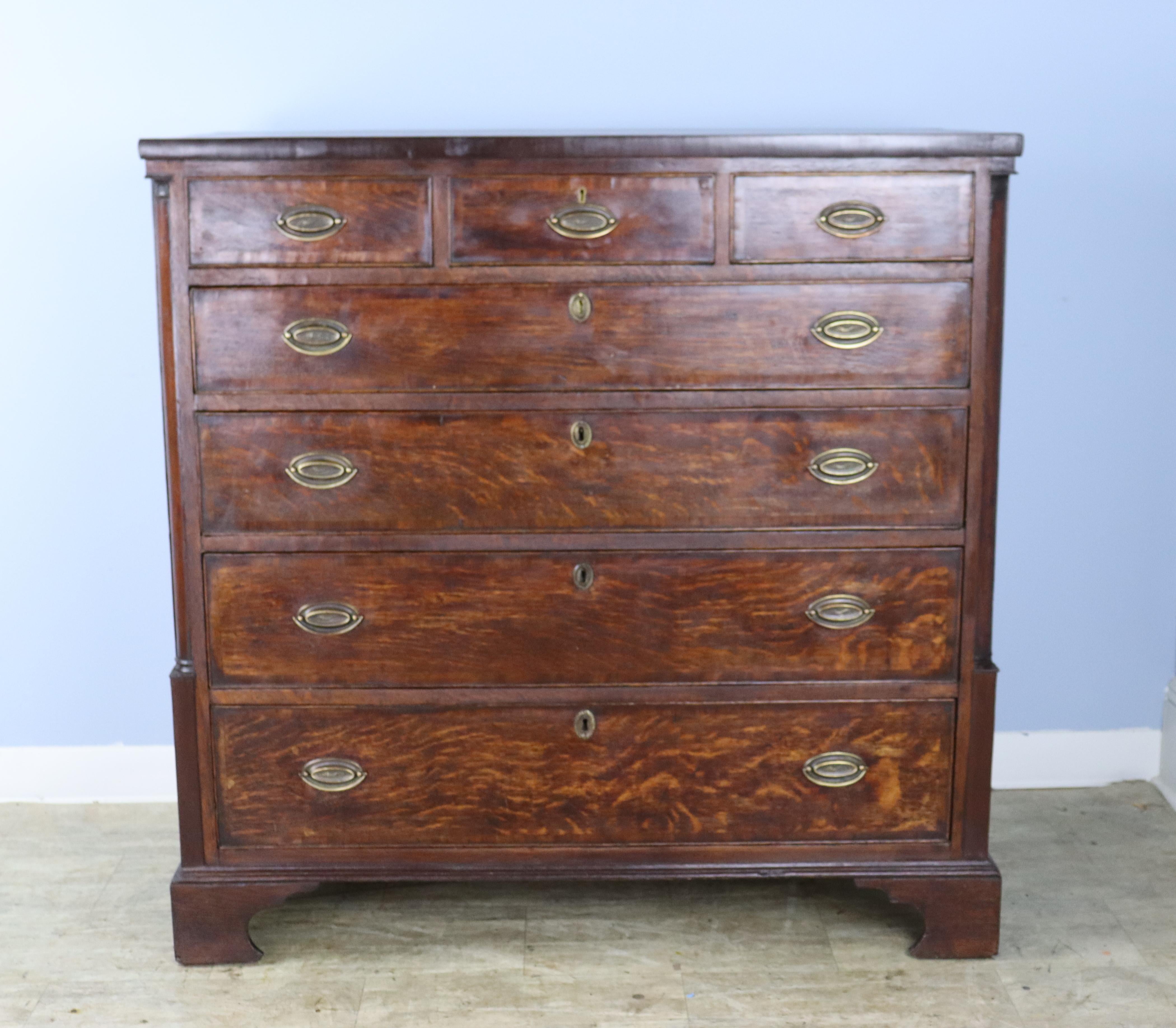 A handsome period Welsh oak 3/4 chest of drawers. The vivid oak grain and intact cockbeading around the drawers make this chest so appealing. Four roomy drawers under three smaller drawers, so lots of good storage. Original ogee feet complete the