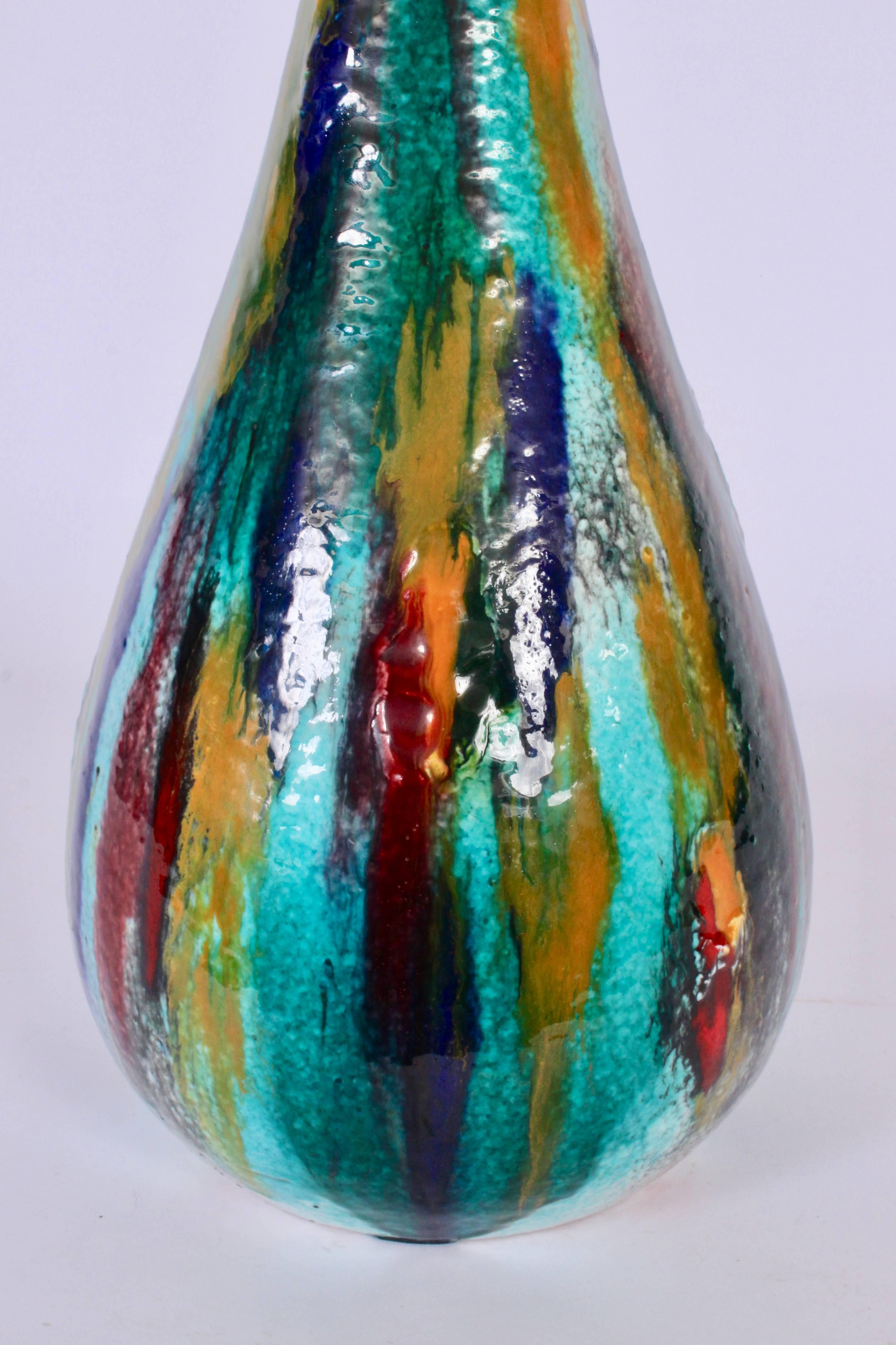 Statuesque and lively multicolored drip glazed Italian Abisola Ceramic Vase, 1950s. Featuring sea shore tones in Turquoise, Aqua, Green and Blue with Purple, Mustard and Red accents. Top 2D. Abstract. Reflective. Rarity. Made in Italy. Signed IAMA