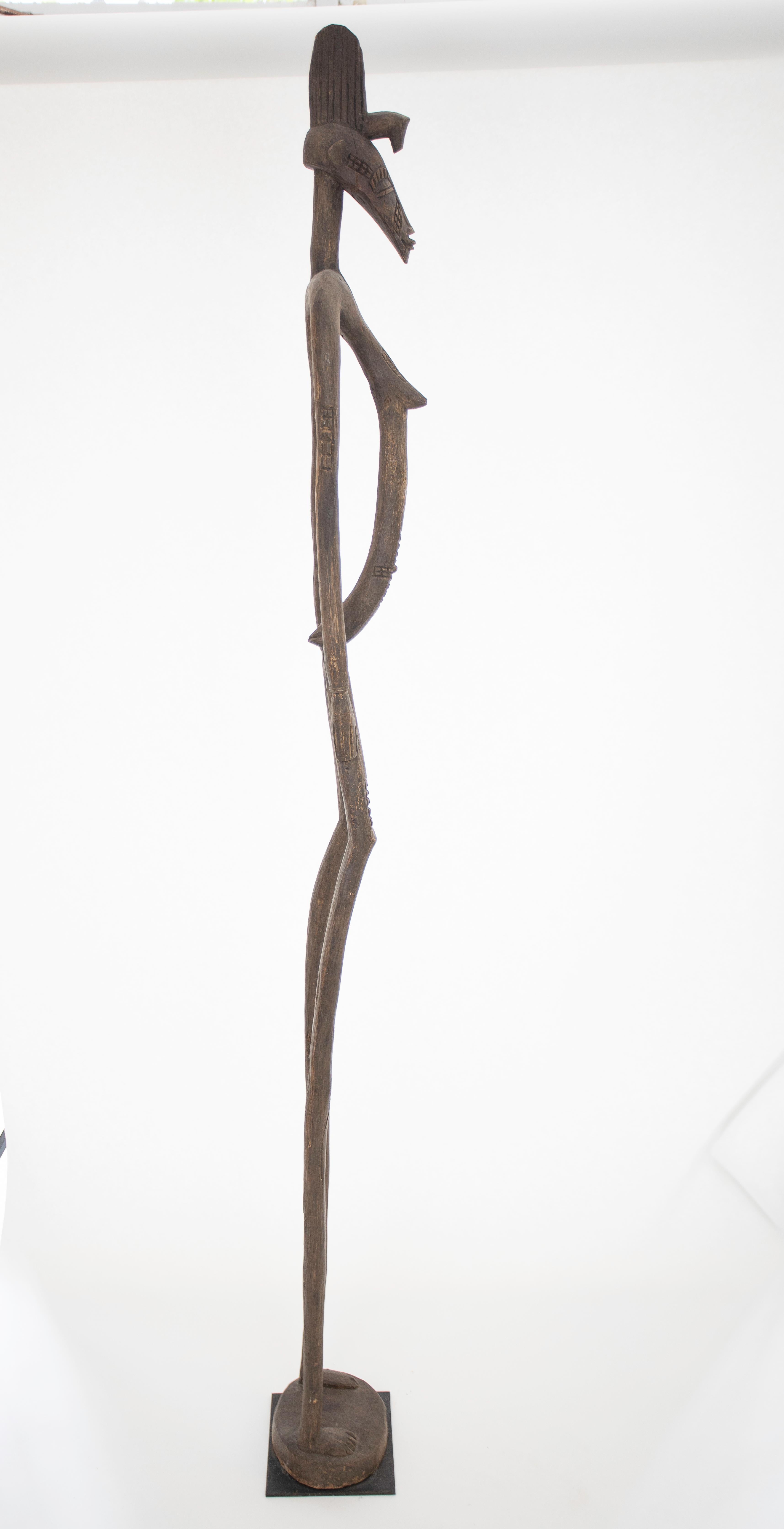 Un martellatore ritmico africano in legno intagliato Senufo