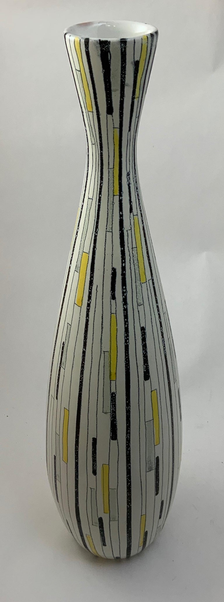 Tall and elegant geometric patchwork decorated vase in black, gray, white and yellow glazes. Fully signed on bottom, B 105, Italy (Italy). Aldo Londi for Bitossi, circa 1950-1960. Good condition. No visible chips, cracks, crazing or