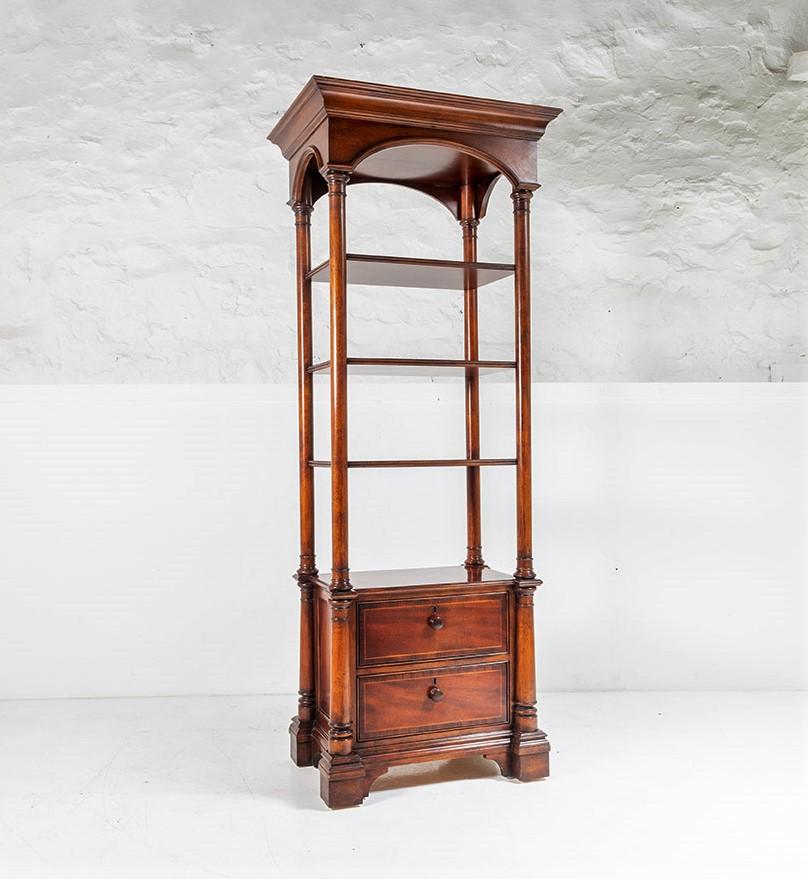 An impressive American Thomasville display cabinet in the Regency style. A narrow tall unit with good detailing in a beautiful warm mahogany colour.

A 20th century piece so not an antique but still of superb quality.
A tall unit at 2m in height