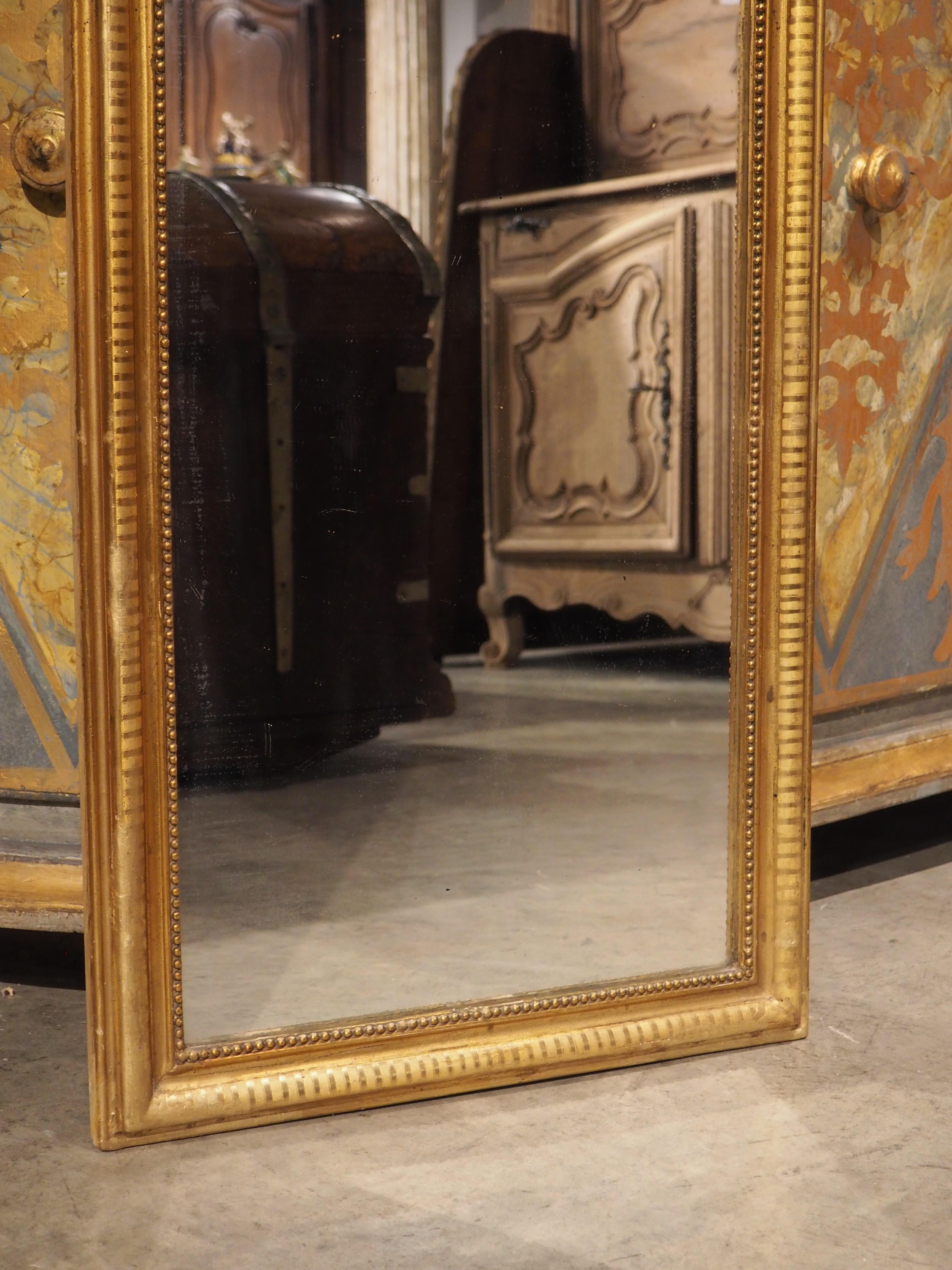 Louis Philippe mirrors are always in high demand, as their clean lines and subtle embellishments mesh with almost any style of interior design. The understated elegance of this period Louis Philippe (circa 1840) mirror is magnified due to the