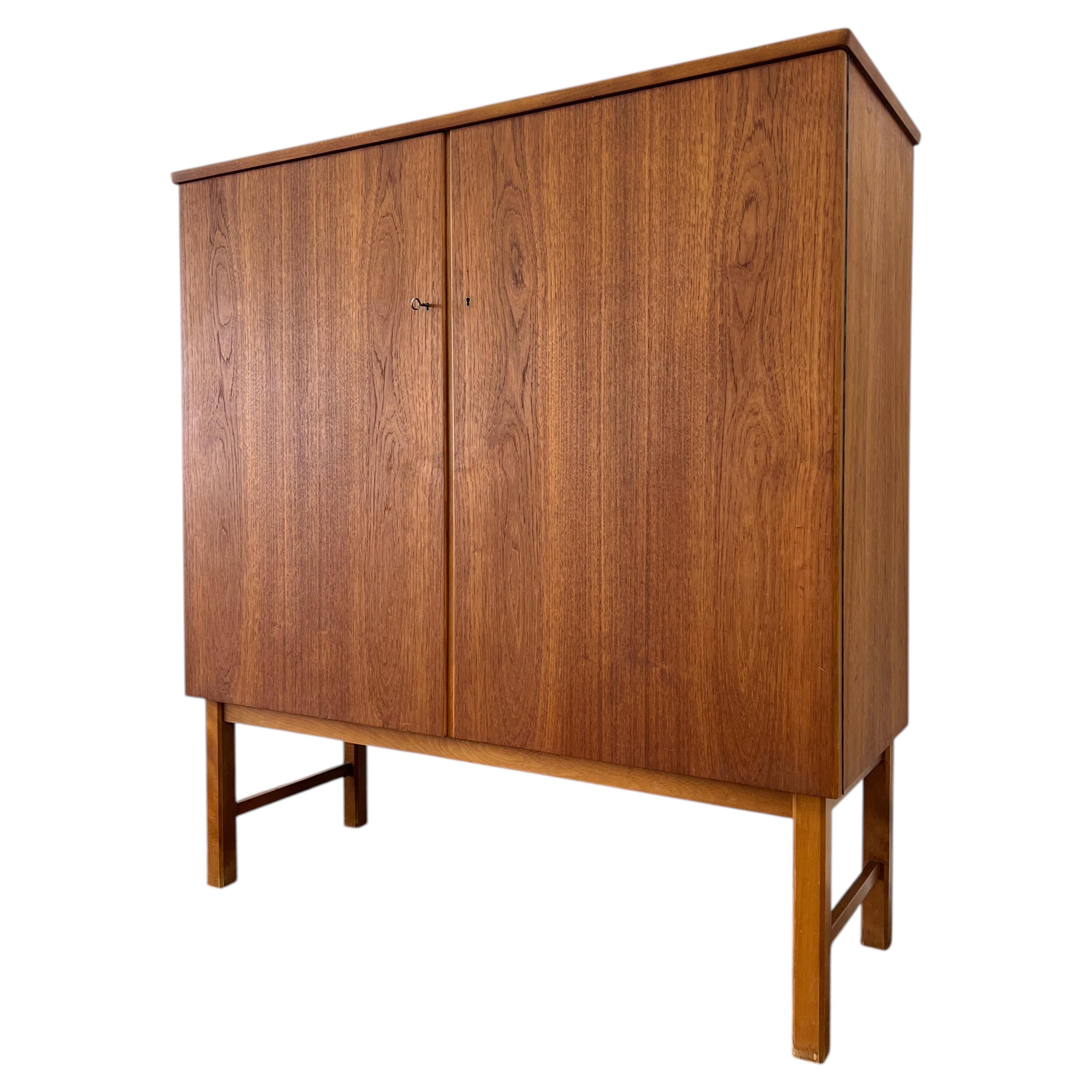 Tall and wide Mid Century Danish Modern Teak cabinet. so much storage. Beautiful