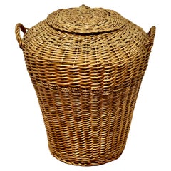 Tall Antique Ali Baba Wicker Laundry Basket  This is an excellent example 