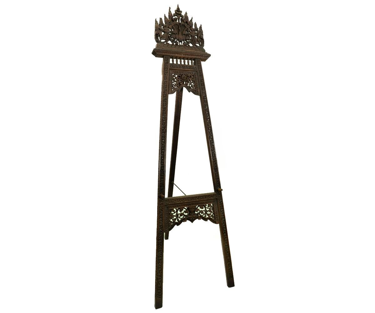 Rarely does one find an antique easel of this quality and extravagance. The Asian hand carved easel is one of the finest we have seen and you won't find another. The carving features a peacock in the center with tail opened surrounded by attendants