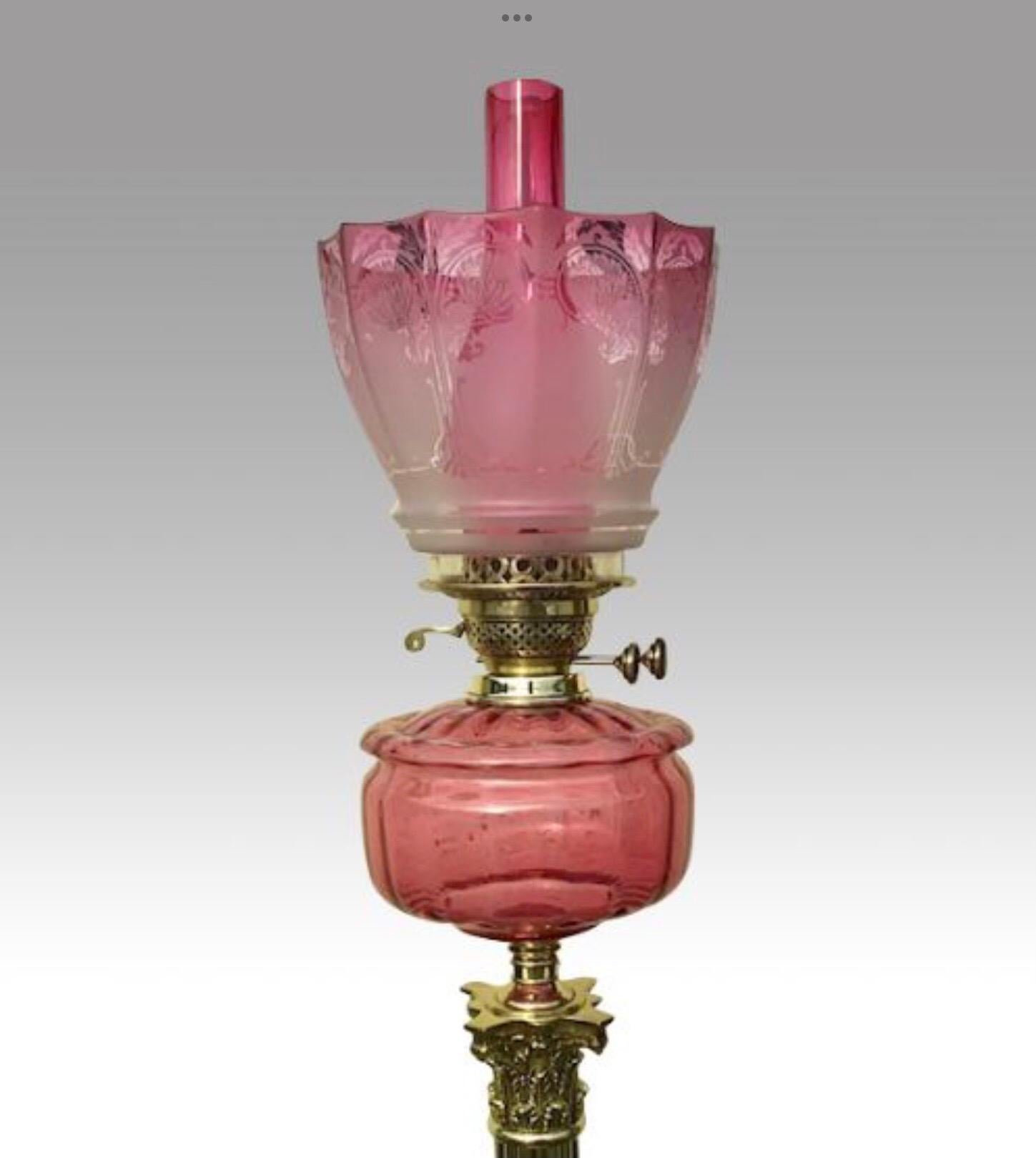 Superb tall antique brass Corinthian column oil lamp with cranberry ruby glass bowl and etched ruby glass etched shade
double burner and fabulous base.
C1890
Measures: 37 ins x 9 ins x 9 ins.