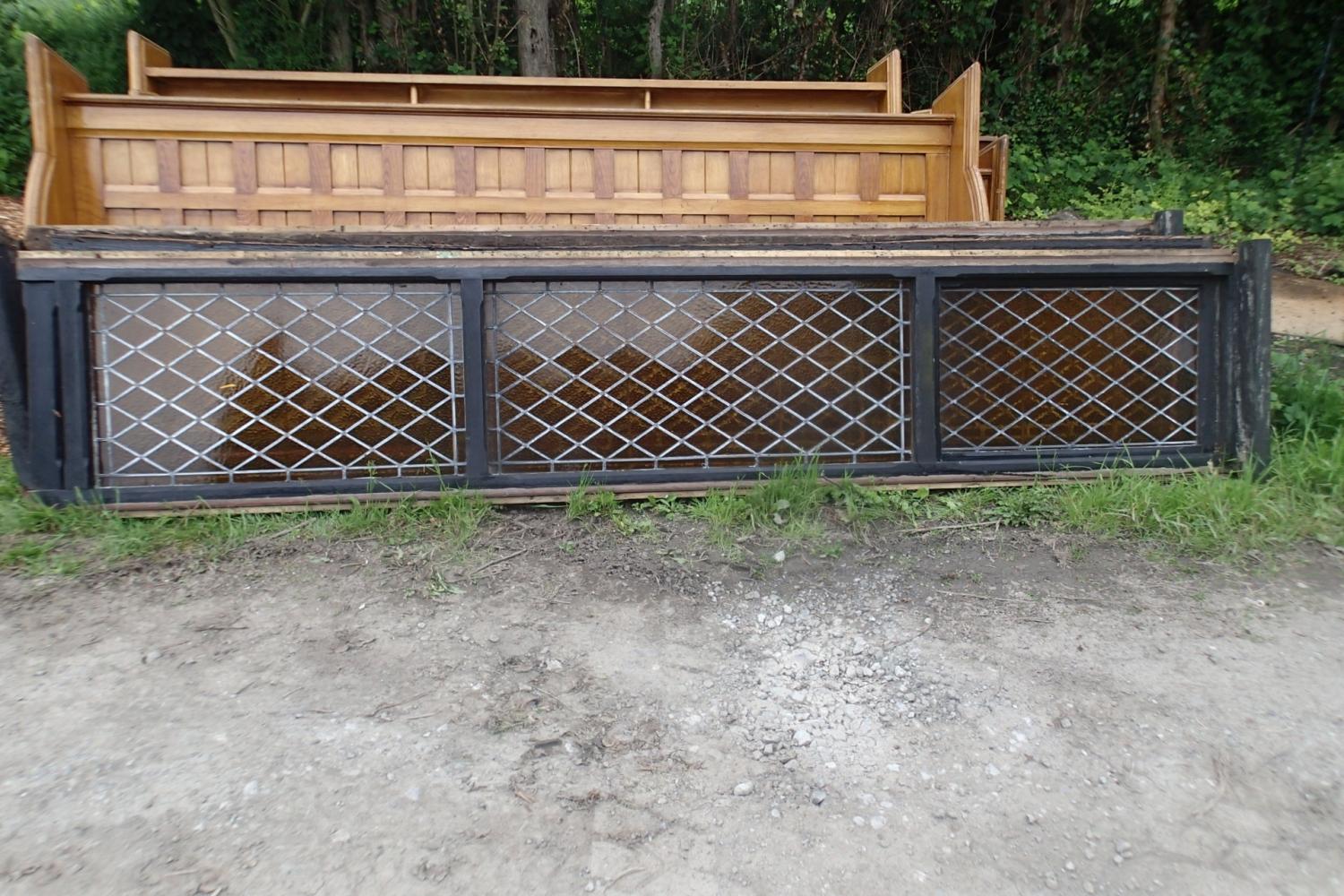 Tall stained glass windows reclaimed from a military church in Telford, circa early 1900's. Amber patterned glass in diamond panes. Could use as is or cut into sections. The overall size of the windows is 366cm x 74cms, but this includes extra