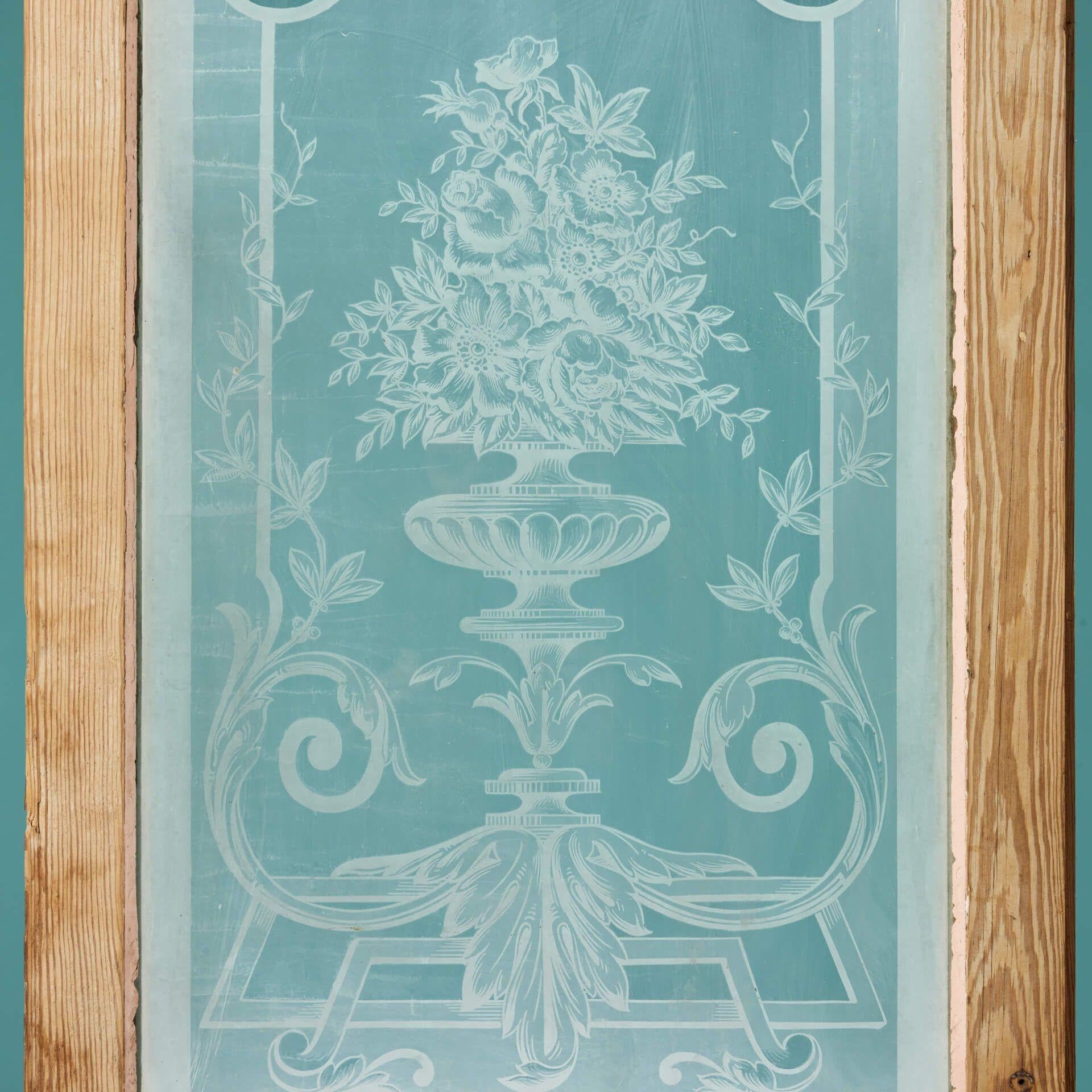 A tall antique French painted acid etched pine door. Suitable for interior use, this striking door is artistically glazed with acid etched glass depicting elegant roses and lilies in a fluting vase. It makes a handsome internal door for a sunroom,