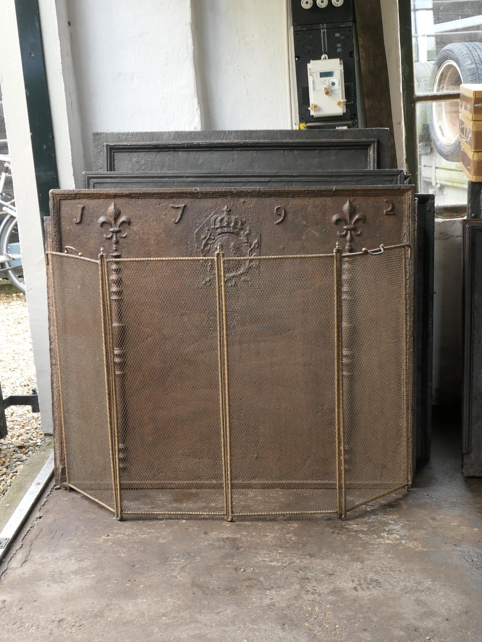 Tall 19th century French Napoleon III 4-panel fireplace screen. The screen is made of brass, iron and iron mesh. It is in a good condition and is fit for use in front of the fireplace.