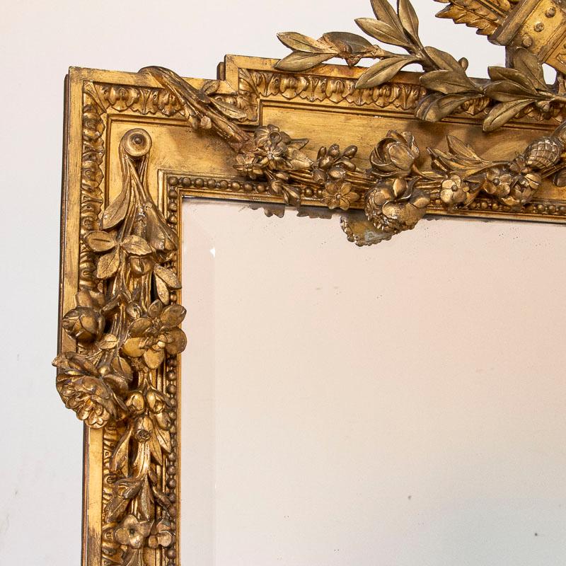 French Tall Antique Gold Gilt Mirror with Torch, Arrows and Flower Wreath from France