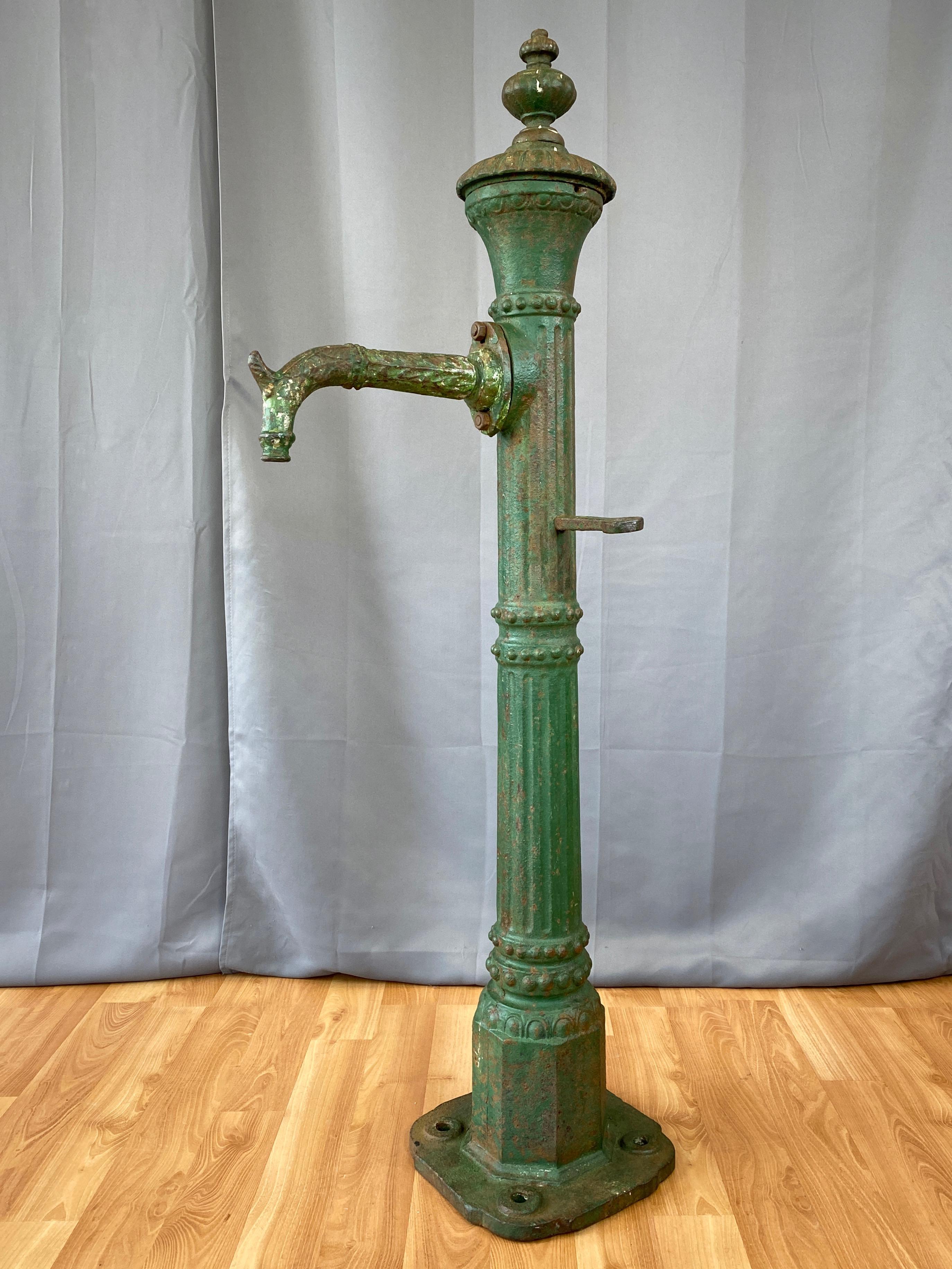 An uncommon circa 1860 tall and substantial street light-style green cast iron water fountain from San Francisco, California.

Fluted columnar form with beaded collars and stacked balloon finial. On octagonal base with four-hole rounded square