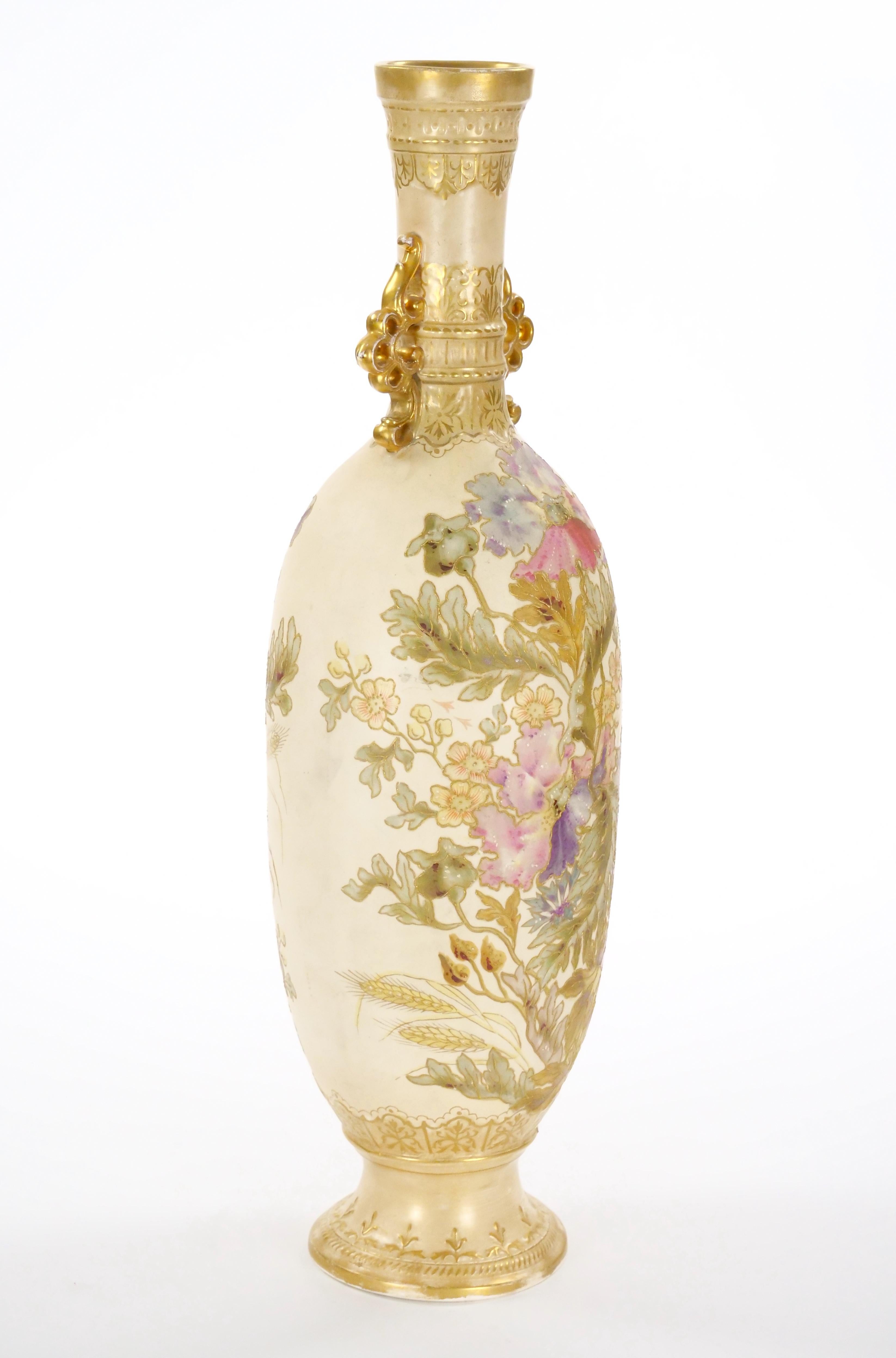 This impressive decorative vase, crafted in the 19th century by the renowned Royal Bonn Company in Germany, stands as a testament to exquisite craftsmanship and timeless beauty. Standing at approximately 23.5 inches tall with a diameter of 7 inches,