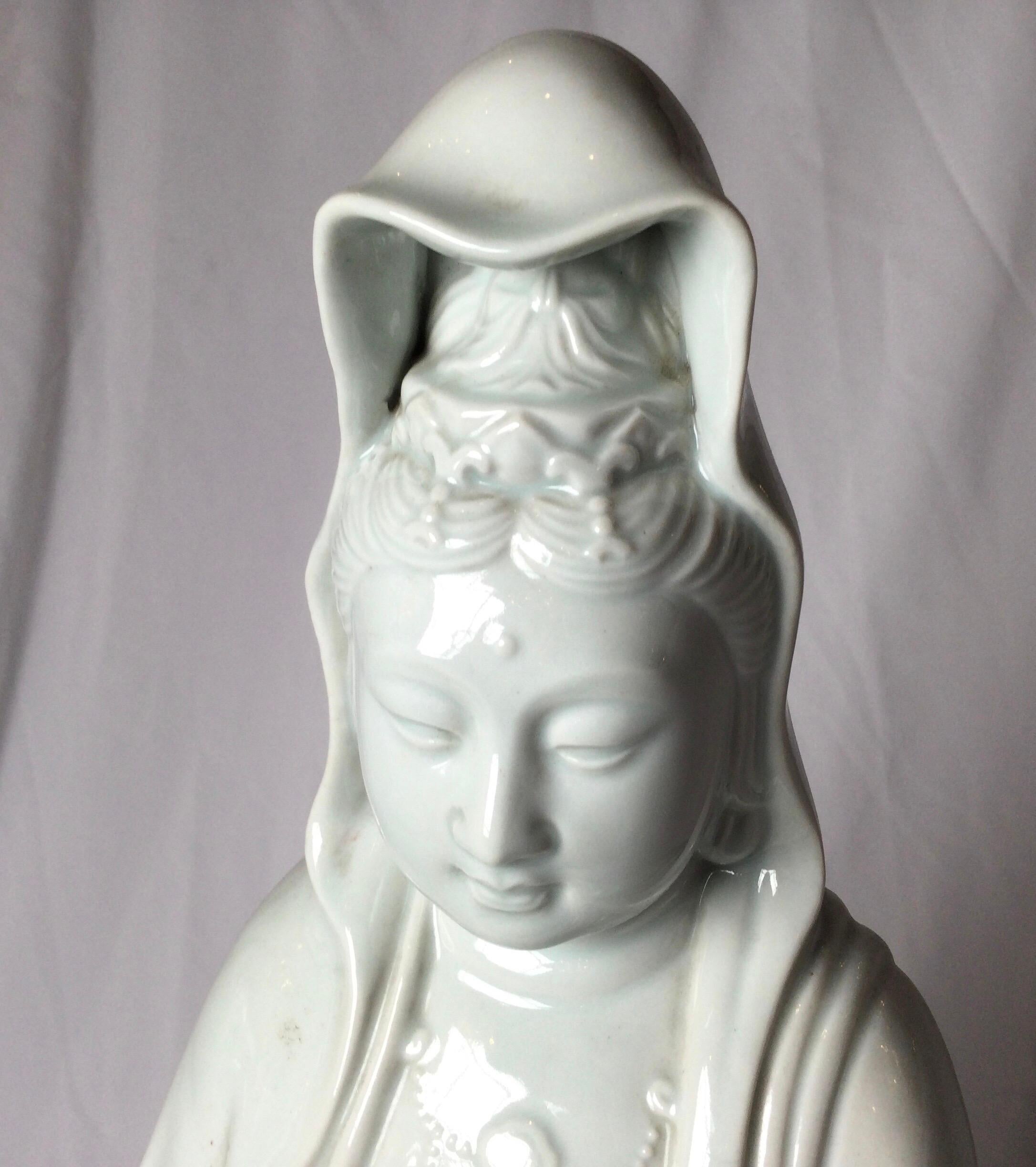 A Classic Japanese Kannon figure in blanc de chine porcelain, circa 1910. Measures: 25 inches tall.