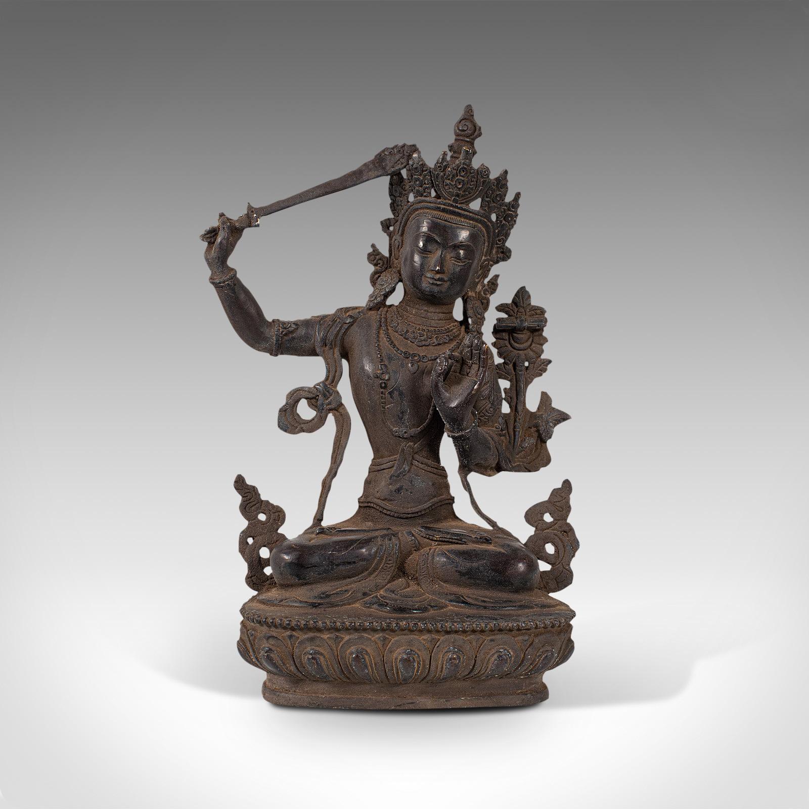 This is an antique Manjushri statue. An Oriental, bronze figure of the seated deity Wenshu, dating to the late 19th century, circa 1900.

Pleasingly tall statue of the Buddhist deity
Displaying a desirable, delightfully patinated
